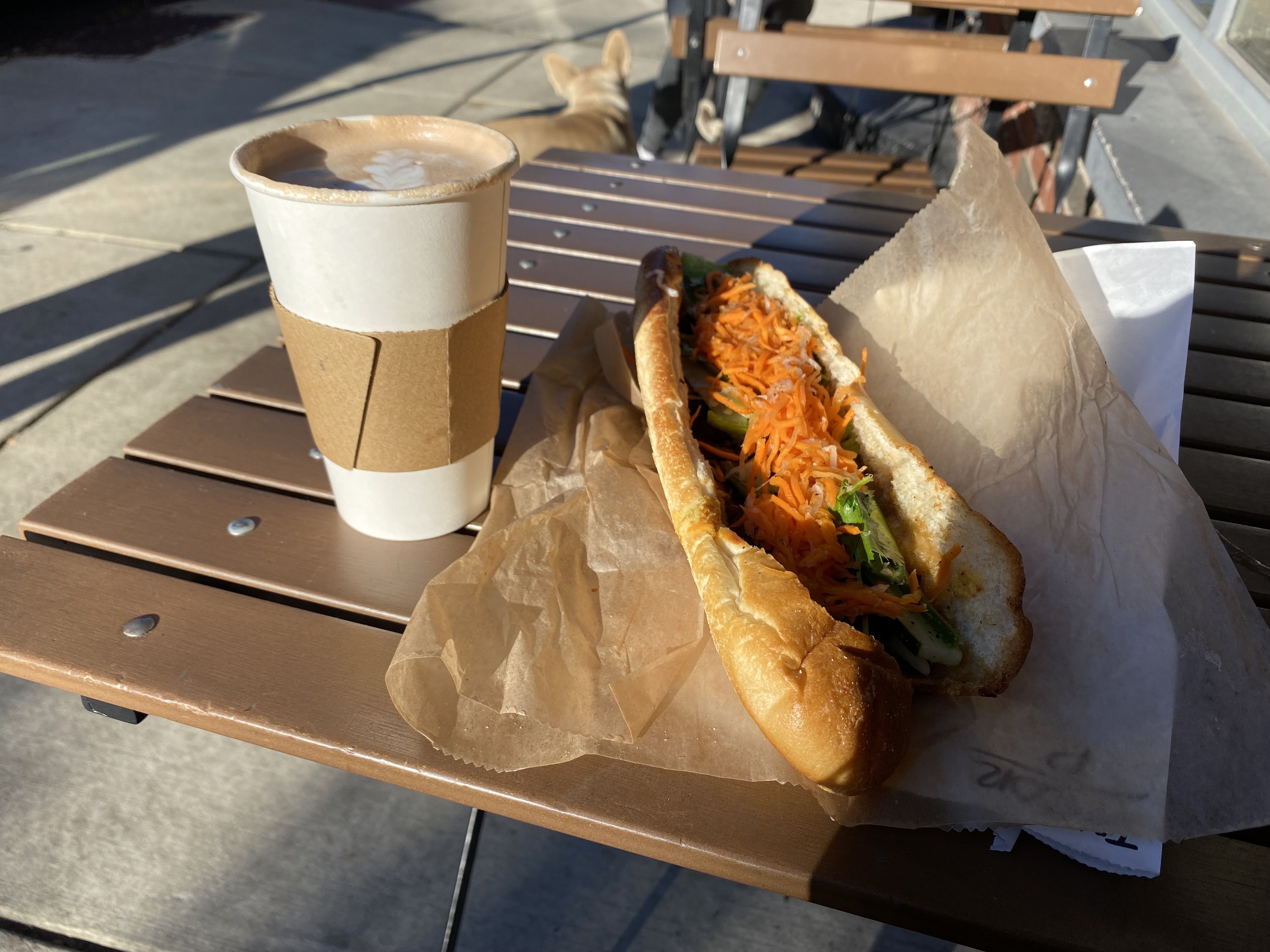 A mocha and a pork banh mi from Brown Street Coffee and Banhery Photo: Taylor Allen/Axios