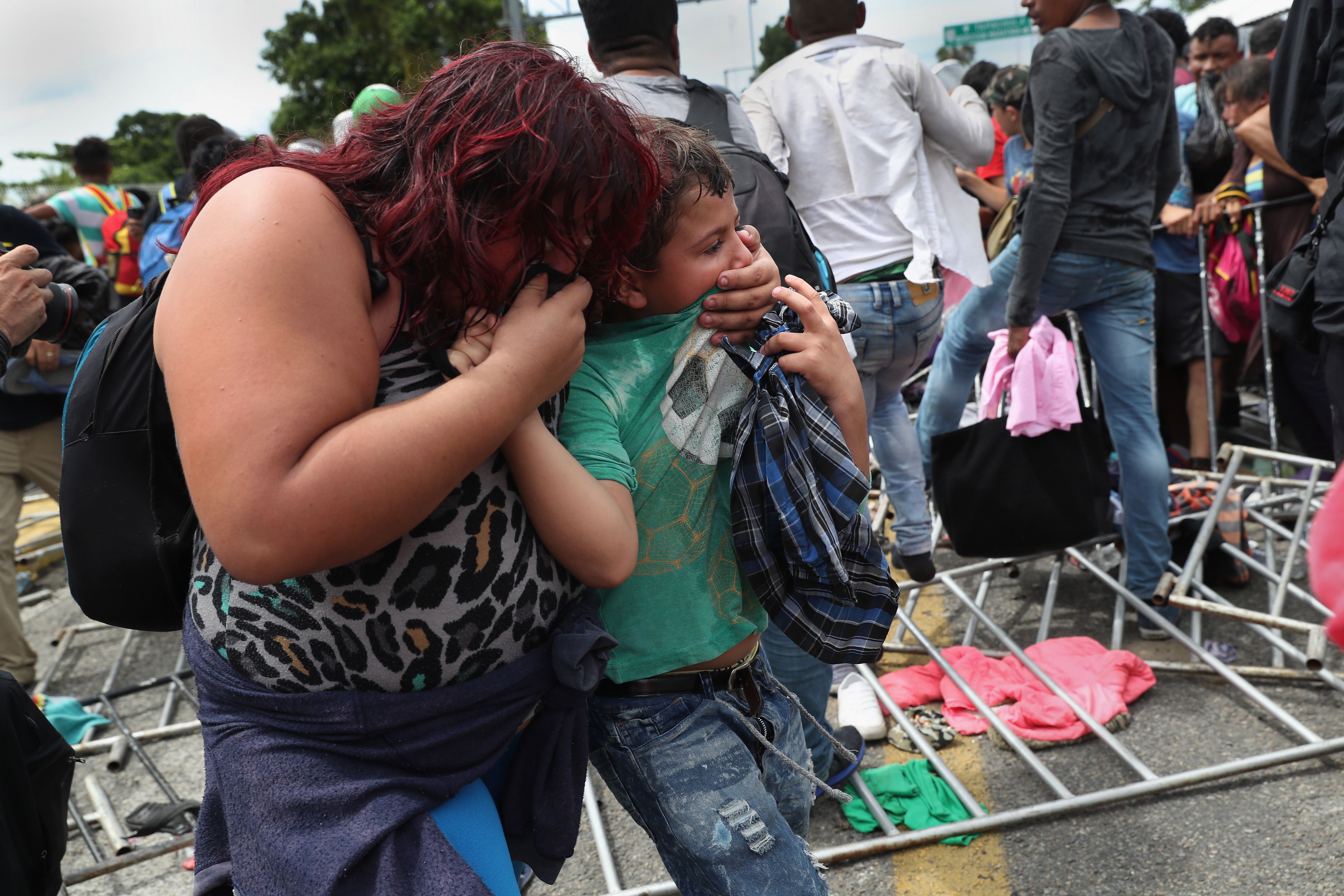 Migrants hit with tear gas