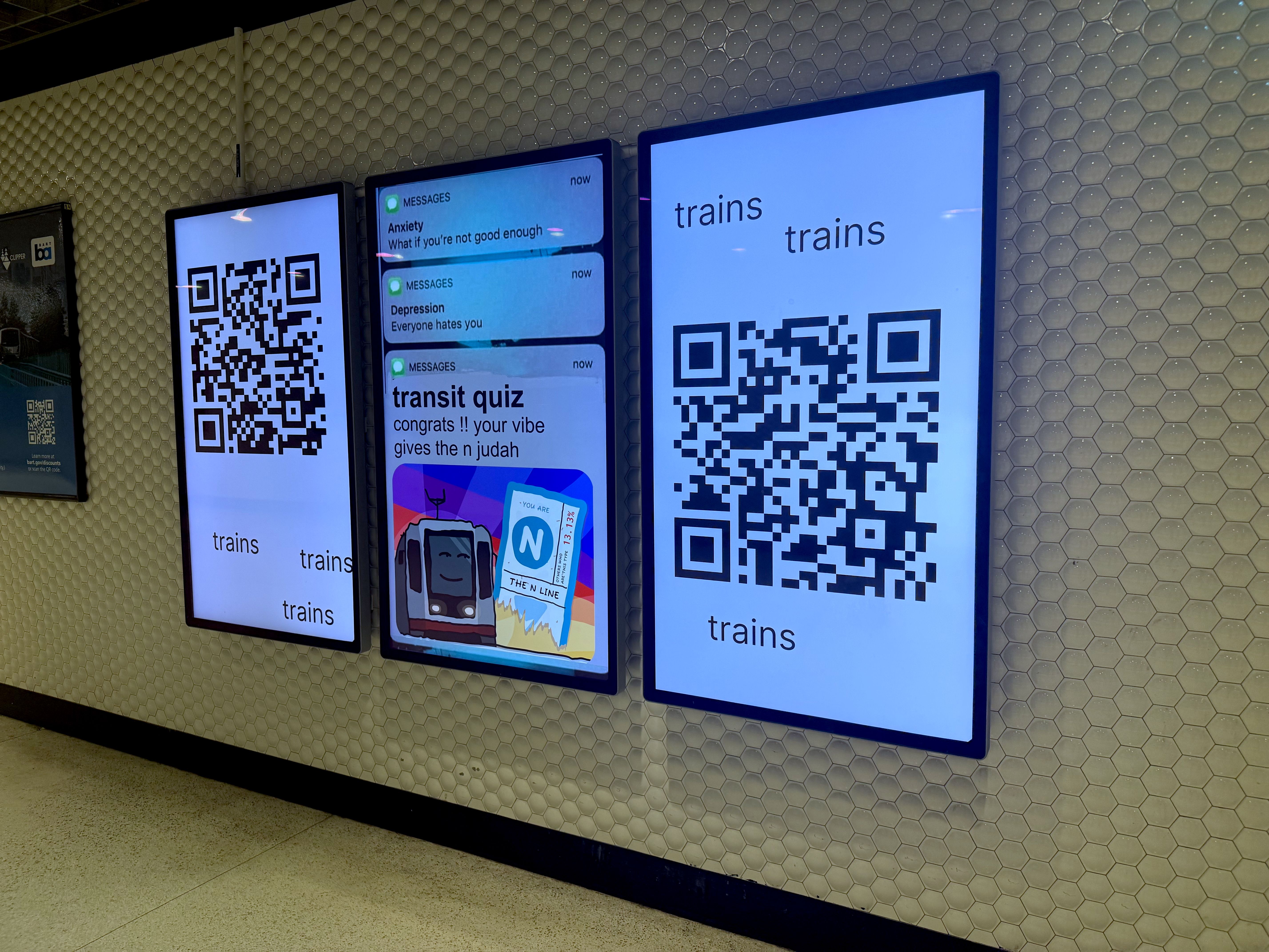 Photo of three screens displaying QR codes for the SF transit quiz
