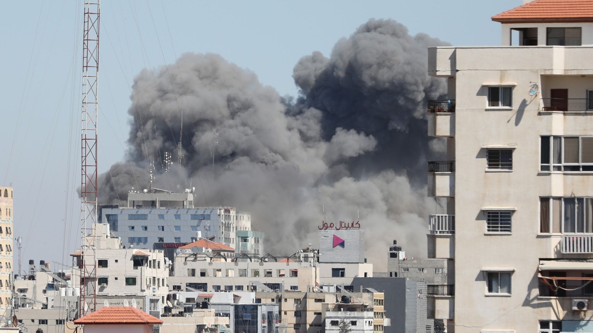 A high rise in Gaza shows smoke after it was hit by an airstrike
