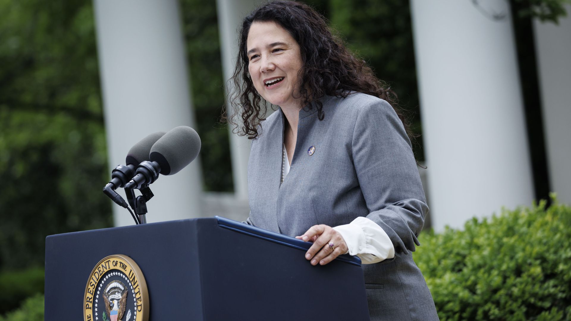 woman standing at podium