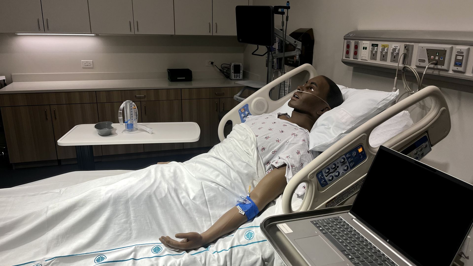 A mannequin in a hospital bed