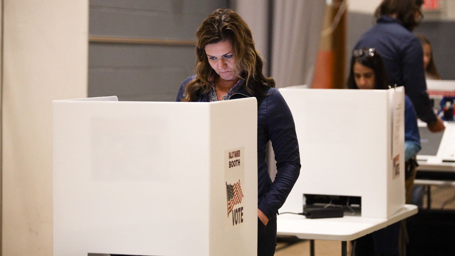 A voter fills out her ballot in Columbus.