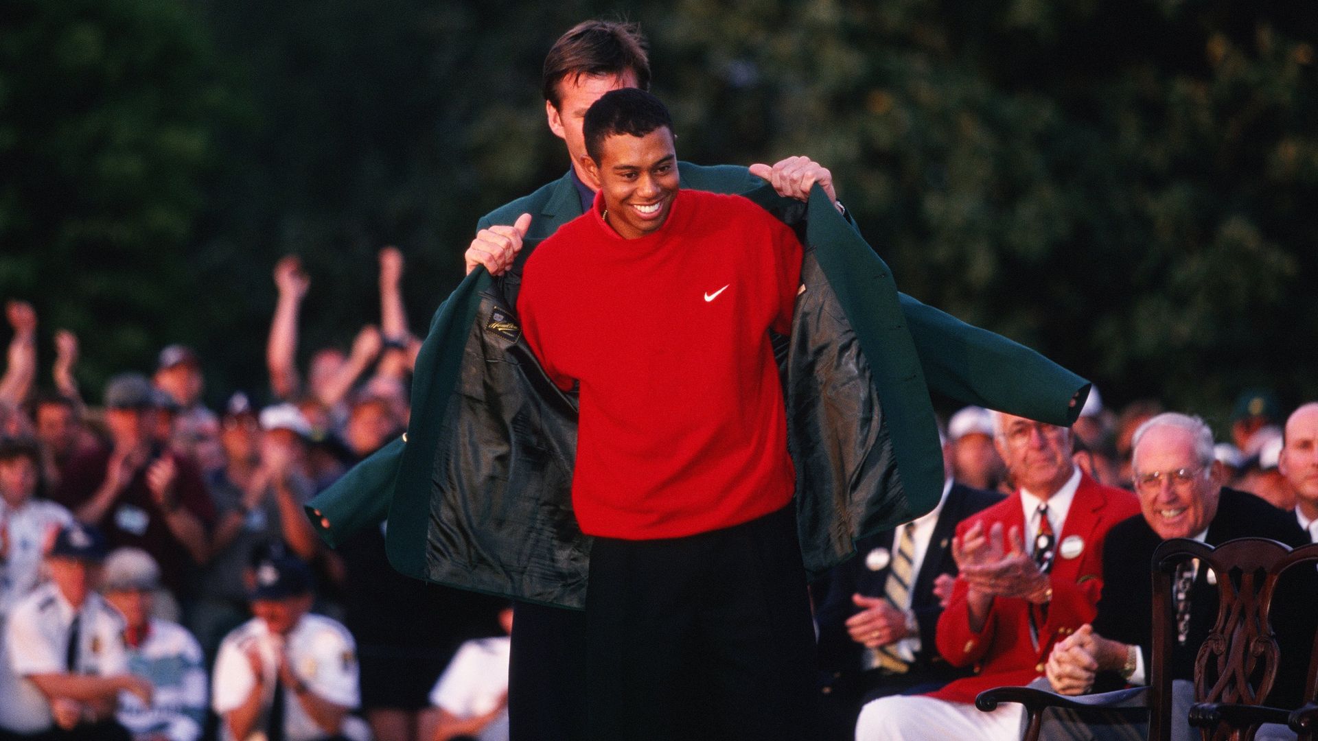 Tiger Woods donning the green jacket