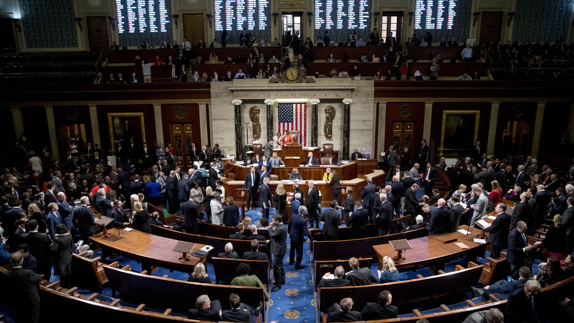 The floor of the House of Representatives packed with Congresspeople. 