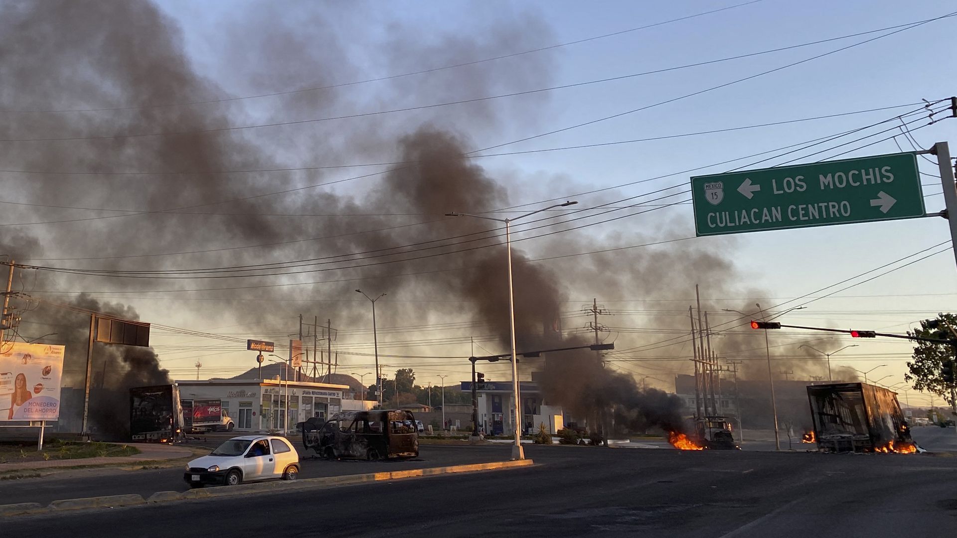 Burning vehicles are seen crossed in the street during an operation to arrest the son of Joaquin "El Chapo" Guzman, Ovidio Guzman, in Culiacan, Sinaloa state, Mexico, on January 5.