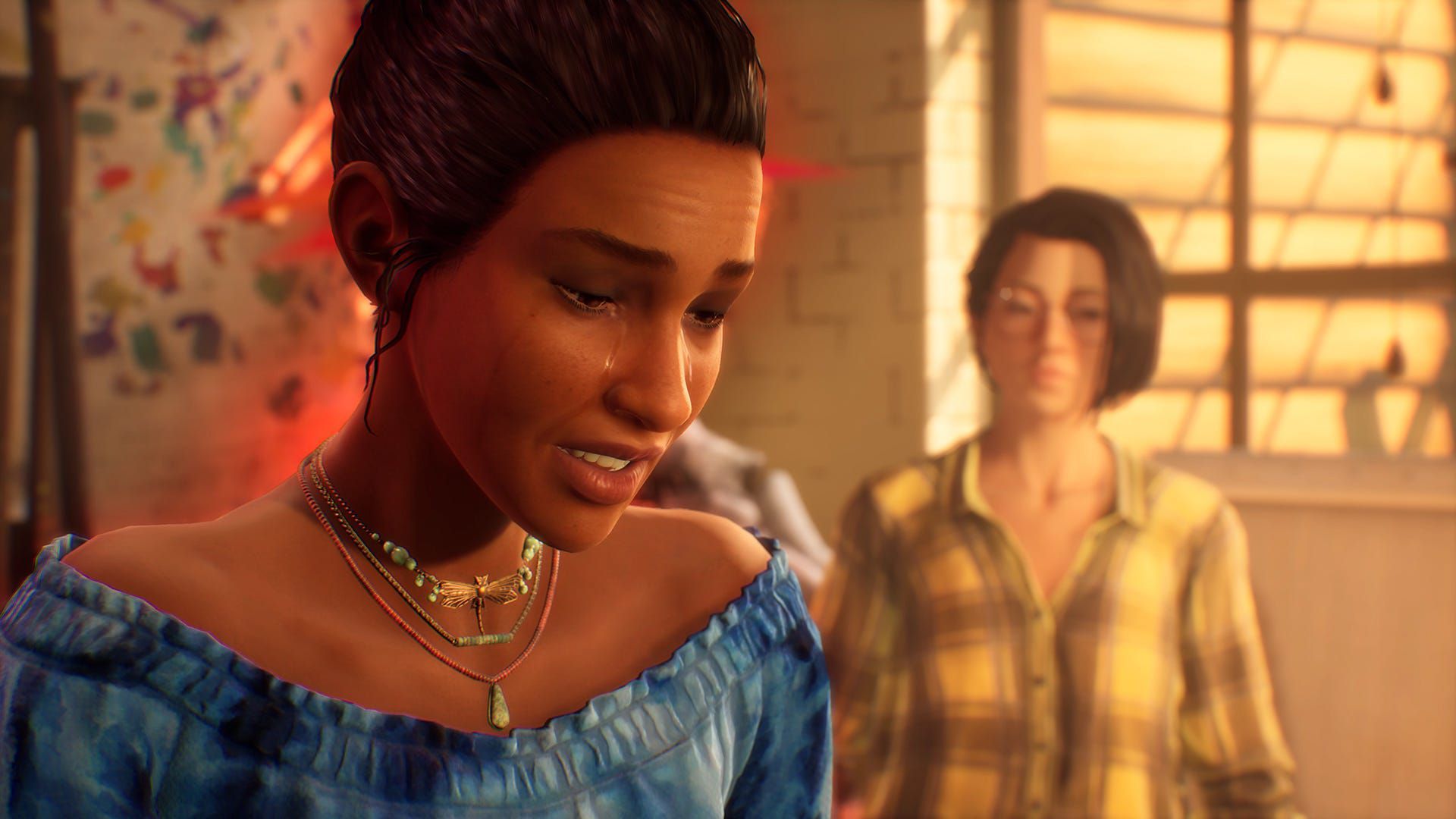 Girl crying in front of another person.