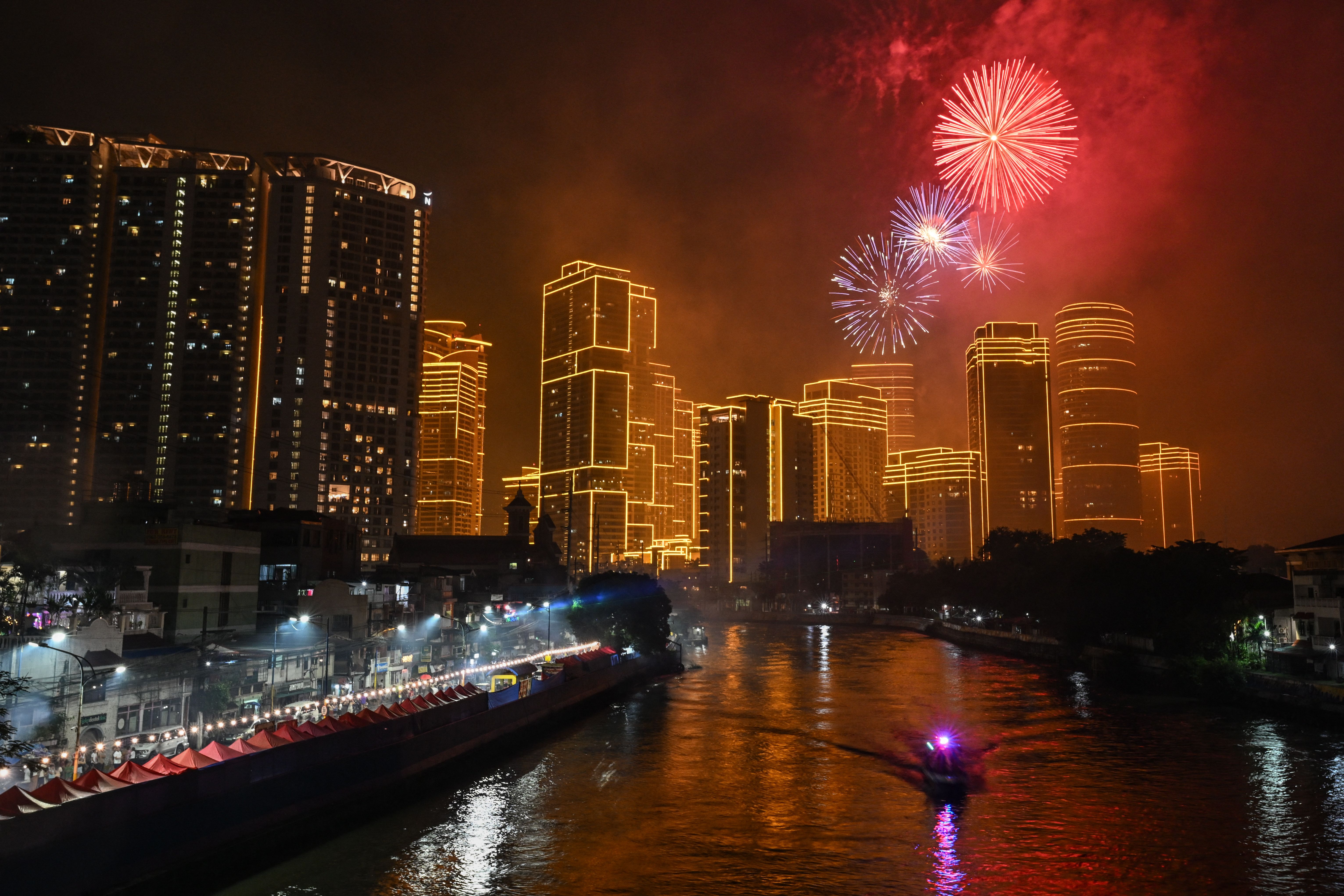 Fireworks light up the sky ushering in the New Year in Makati, Metro Manila on January 1, 2025. 