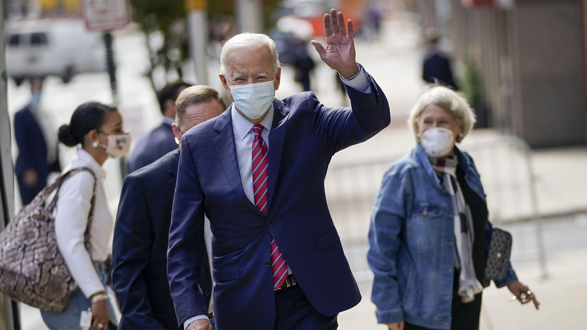 Democratic presidential nominee Joe Biden waves as he departs The Queen theater on October 19