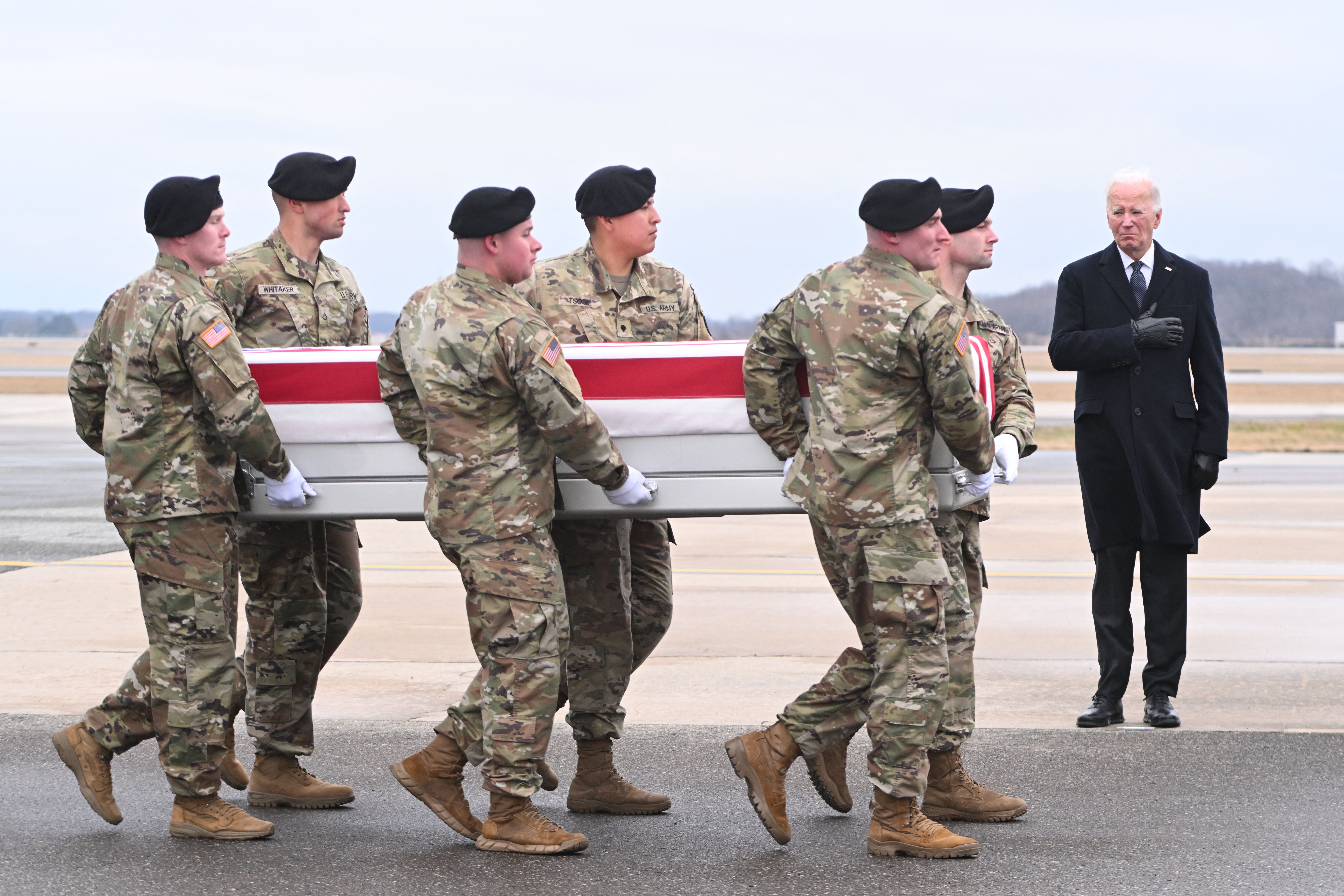 Soldiers carry casket