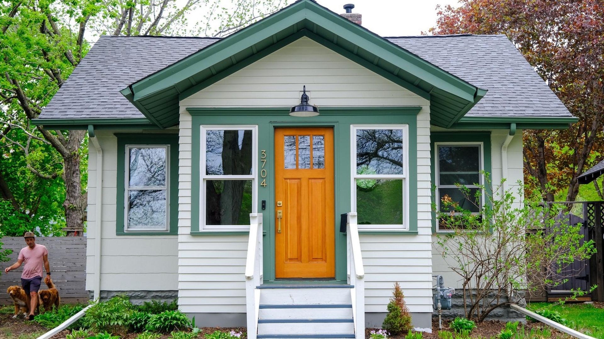white bungalow with green trim