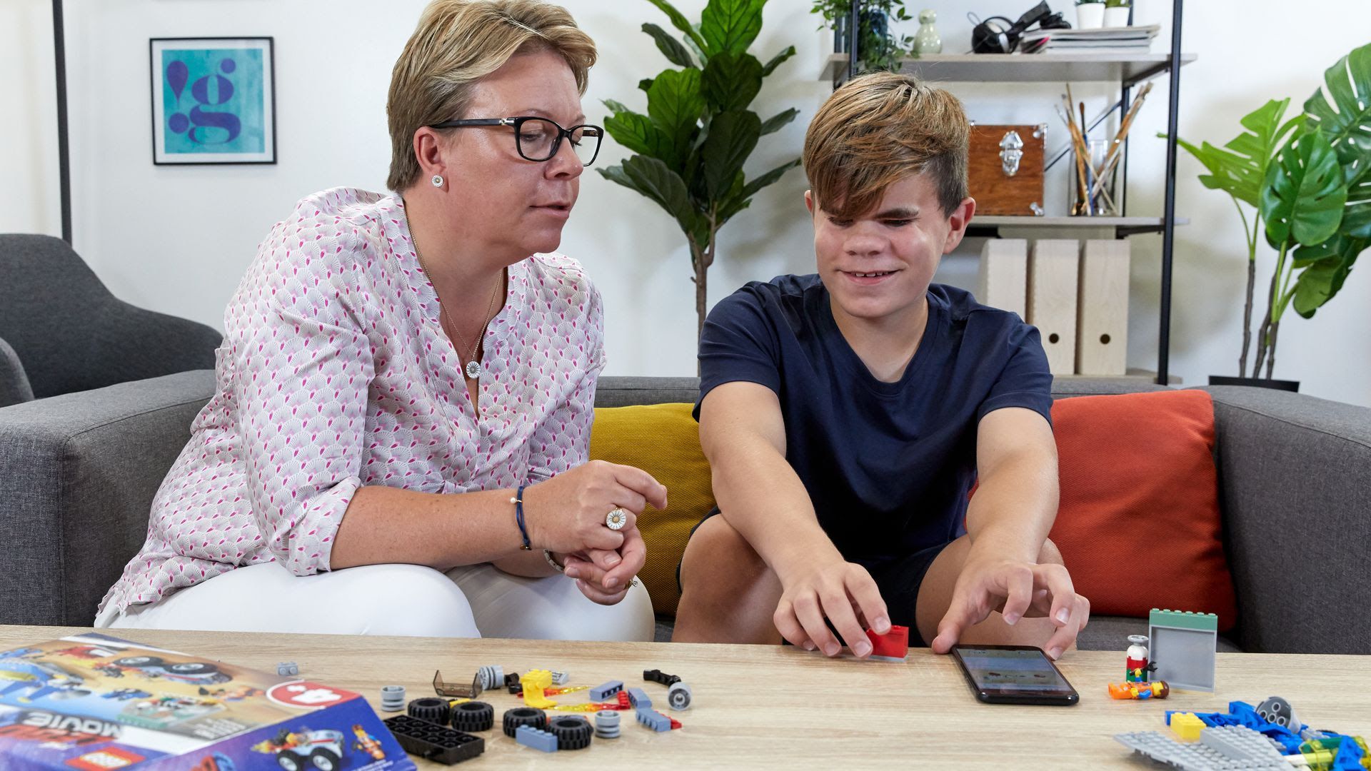 Blind boy building legos