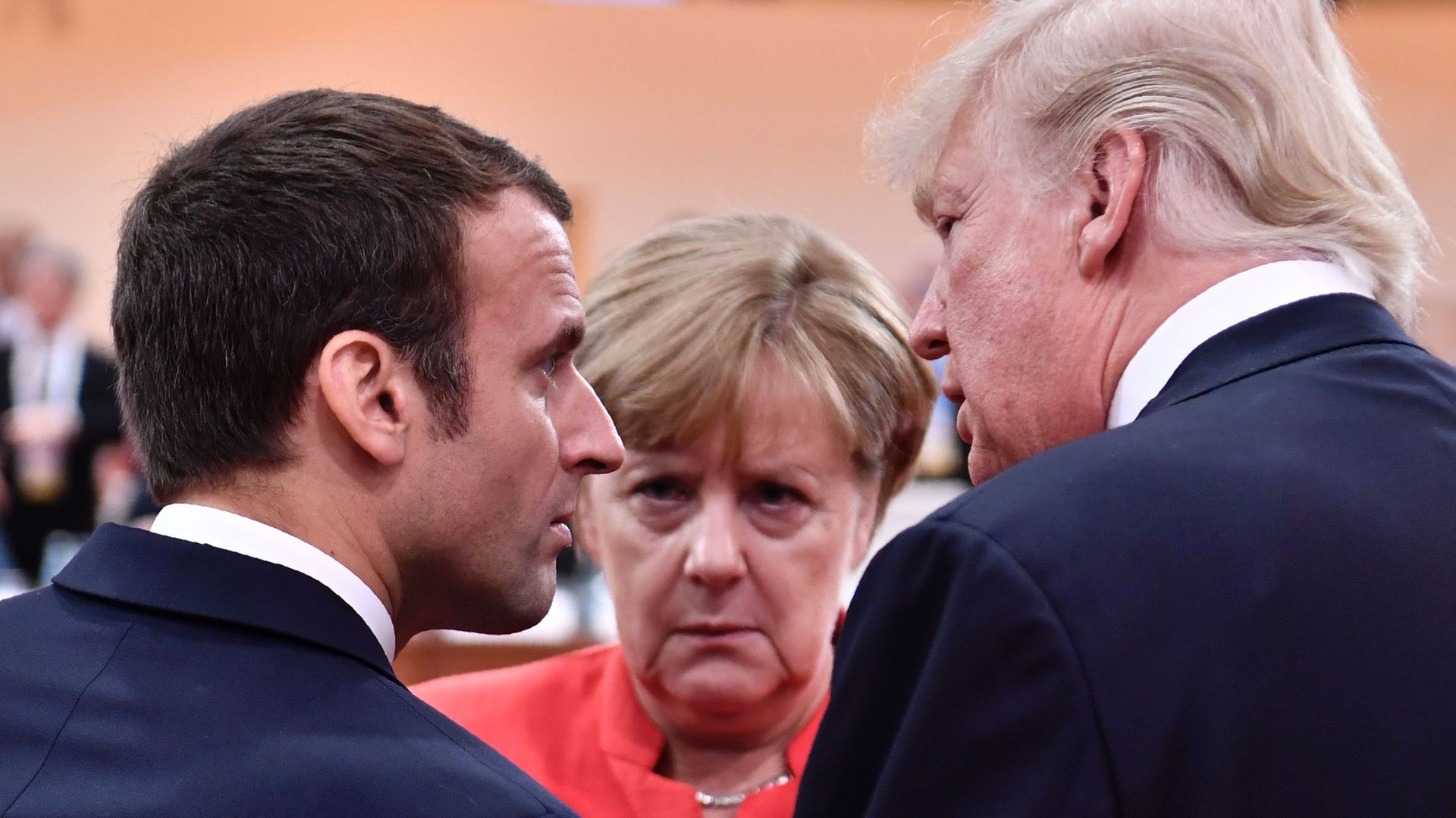 President Trump, French President Emmanuel Macron and German Chancellor Angela Merkel chat at the G20 meeting in Hamburg, Germany, on July 7, 2017