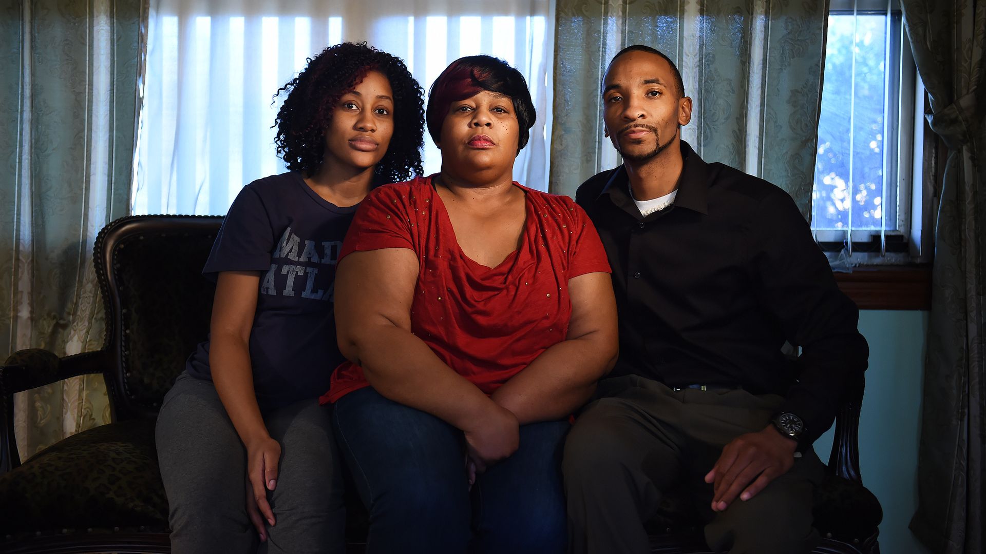 The family of Bobby Daniels Sr. pose for a photo in Lithia Springs, Georgia. Daniels was shot and killed by a sheriff's deputy at Arbor Village mobile home park in 2016. His family says he was trying to defuse a situation involving his son, Bias Daniels.