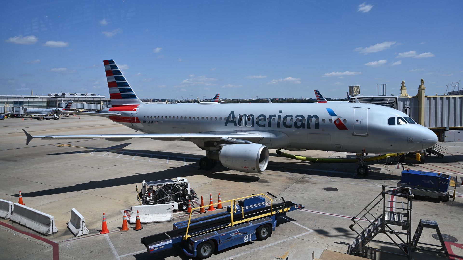 An American Airlines jet sits at a gate at Washington National Airport. 