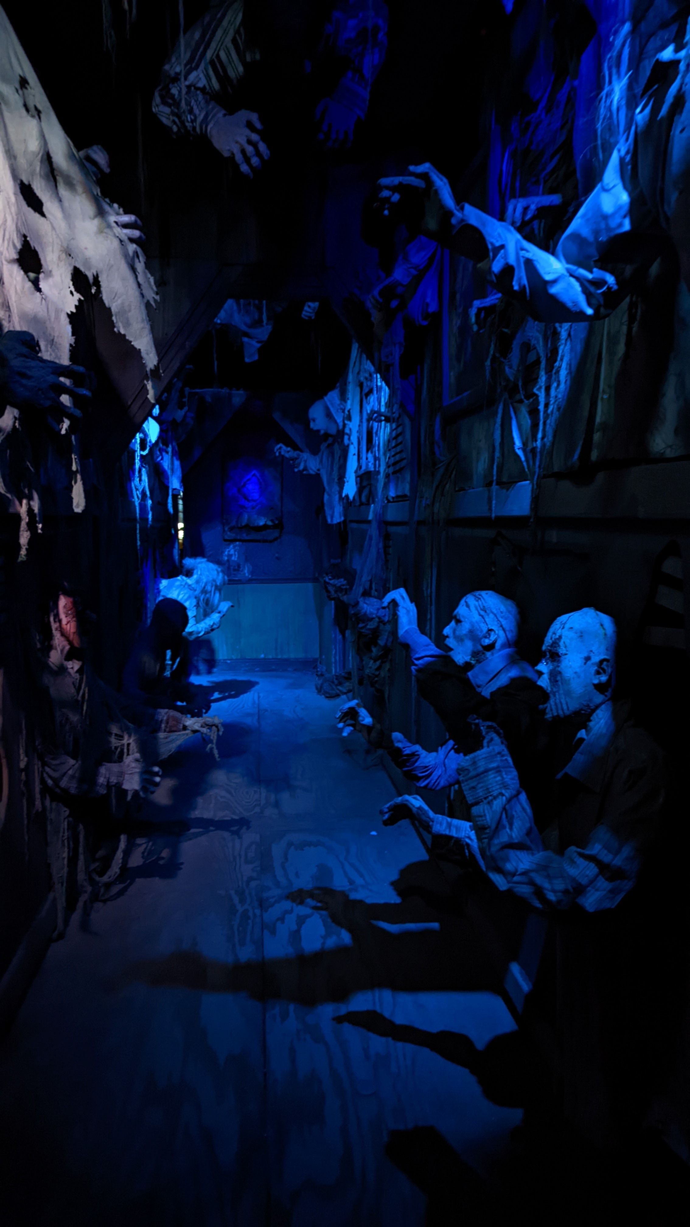 Hands grasp at visitors who walk the path through Fear Factory. Photo: Erin Alberty/Axios 