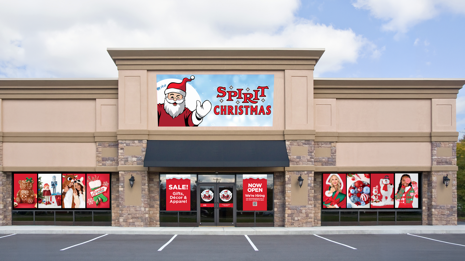 Beige strip mall with a large sign reading "Spirit Christmas" and Santa waving; storefronts show holiday ads and red banners; blue sky, trees, and an empty parking lot.