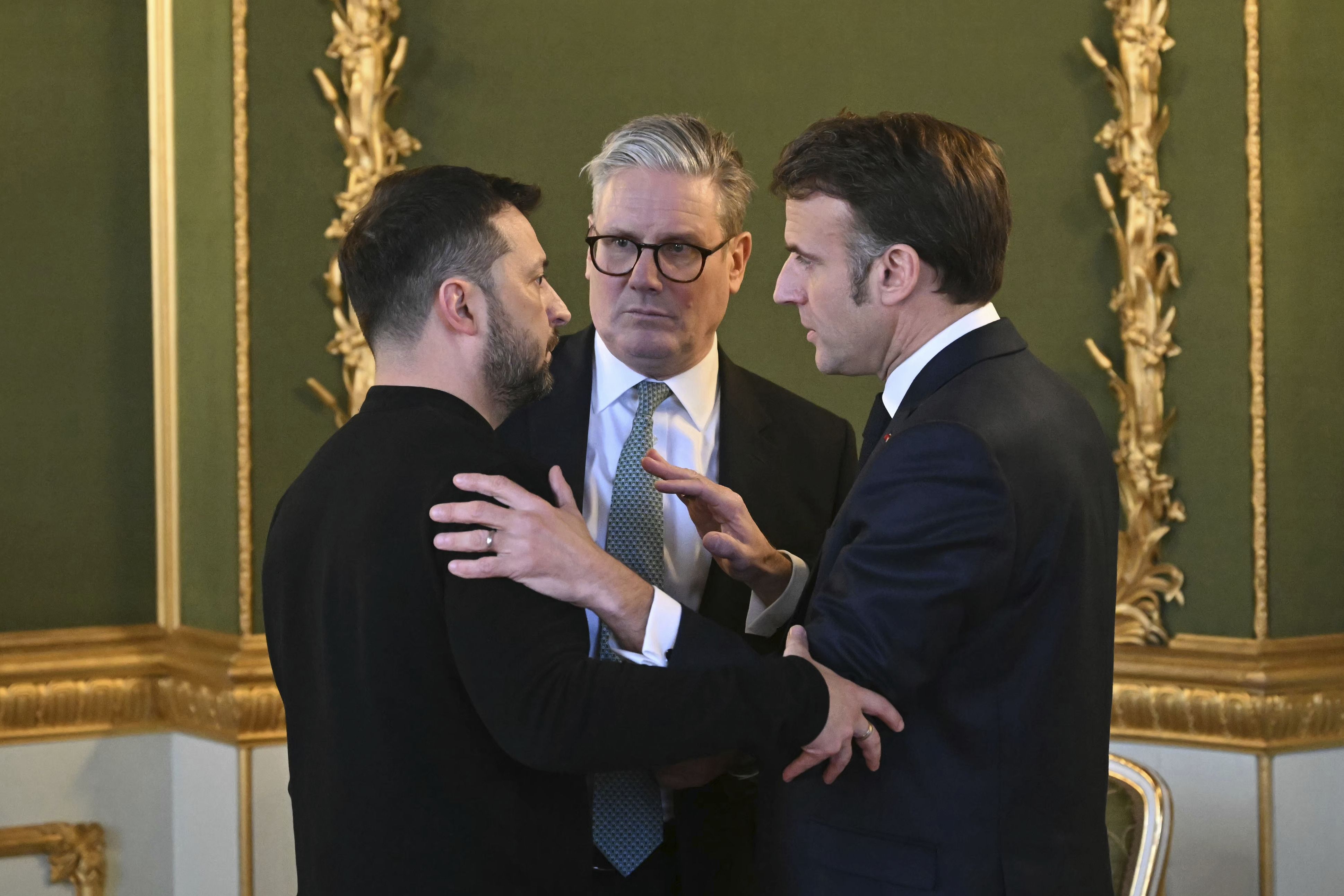 British Prime Minister Keir Starmer, Ukrainian President Volodymyr Zelensky and French President Emmanuel Macron meet during an emergency summit on Ukraine yesterday.
