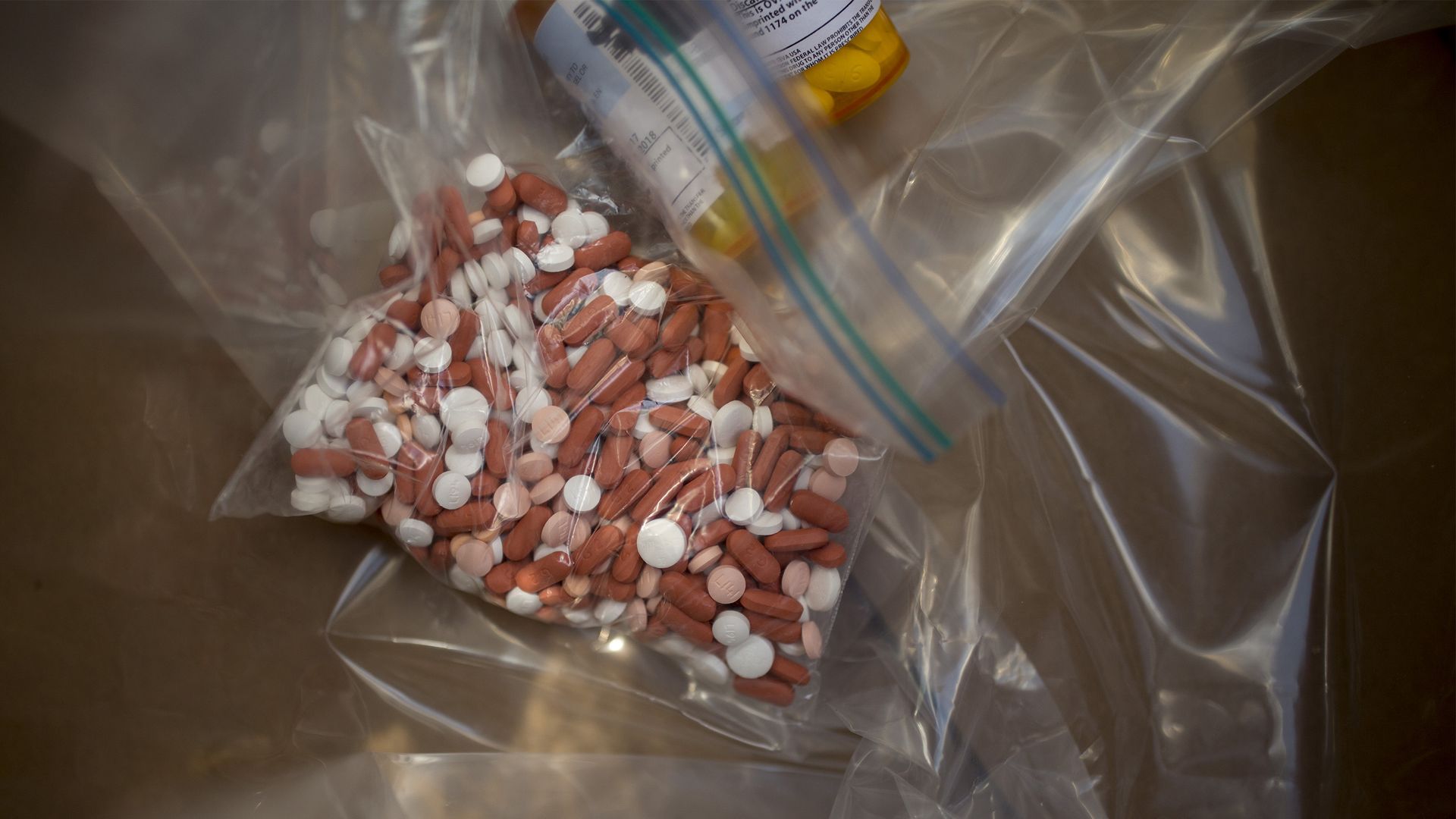 Prescription pills and bottles in plastic baggies.