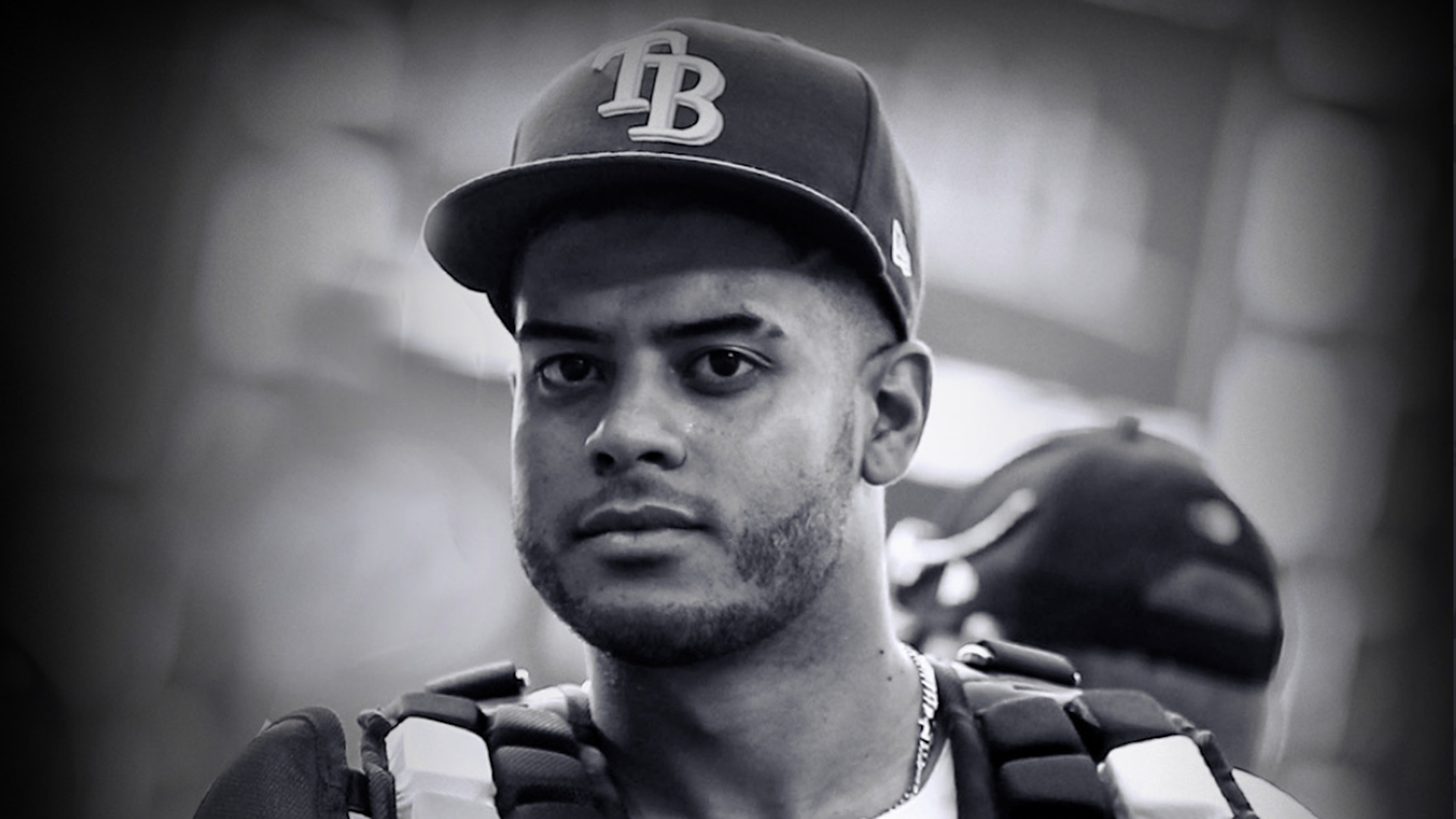 Rays' bullpen catcher Jean Ramirez in a black and white headshot. 