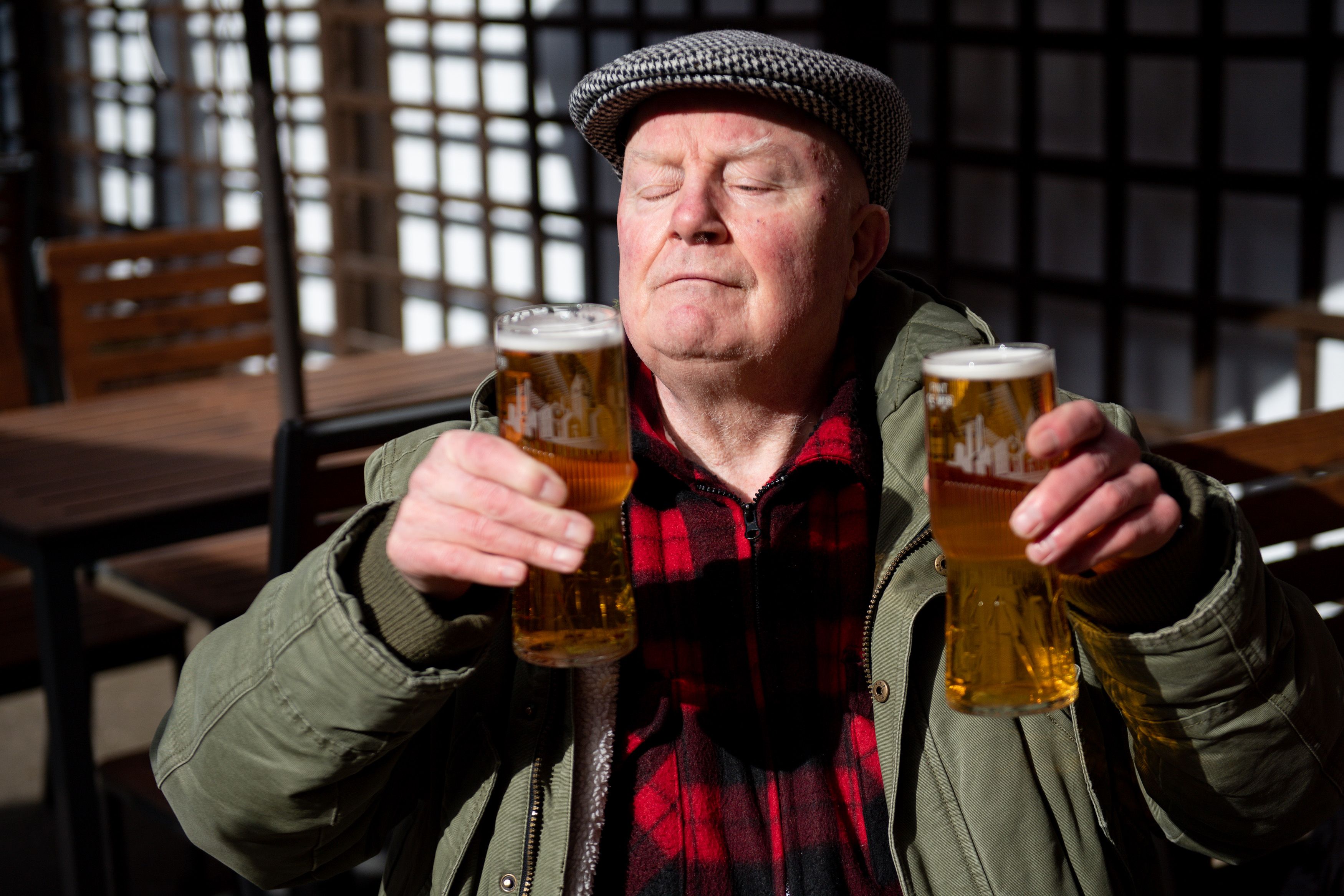 Man enjoying two beers