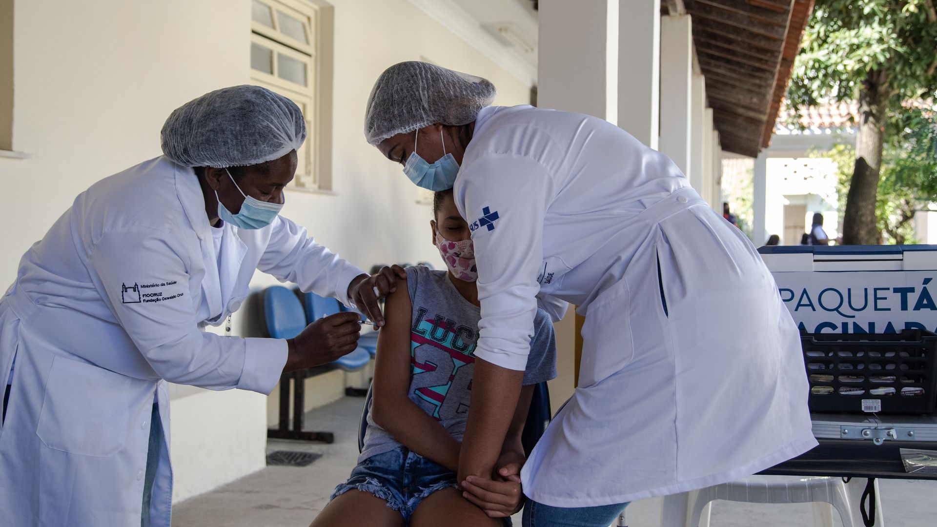 A healthcare worker administers a dose of the Pfizer-BioNTech Covid-19 vaccine 