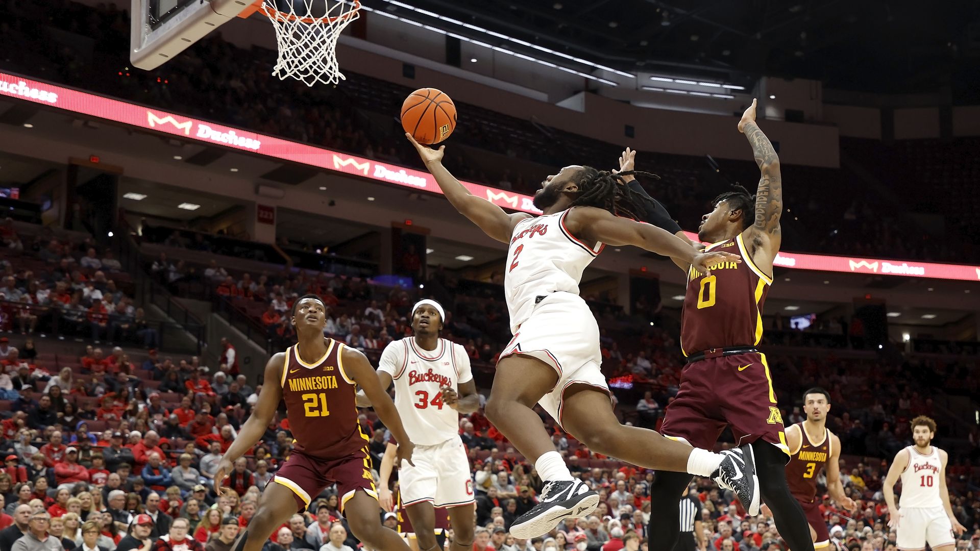 Bruce Thornton is midair while driving to the basket 