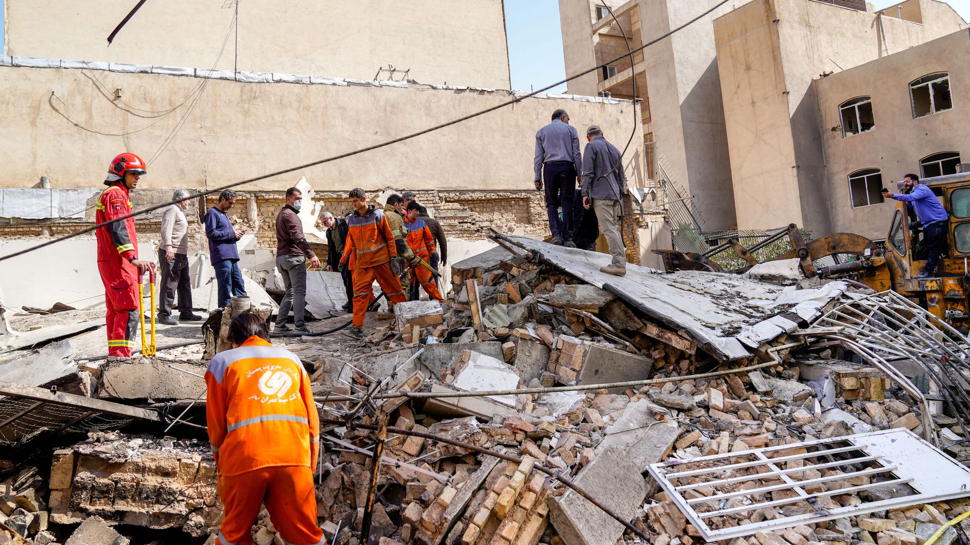 In this picture obtained from Iran's ISNA news agency, rescuers search through the rubble of a collapsed building at the site of a strike on a neighborhood, in Tehran on February 28, 2026.