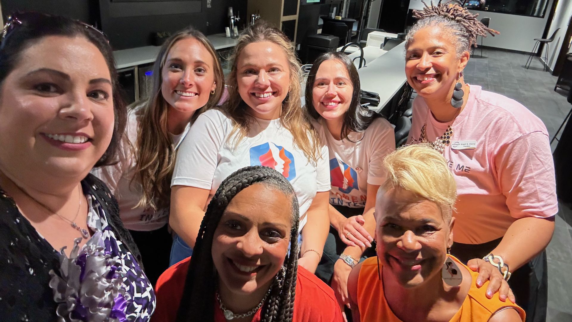A group of women smiling at the camera