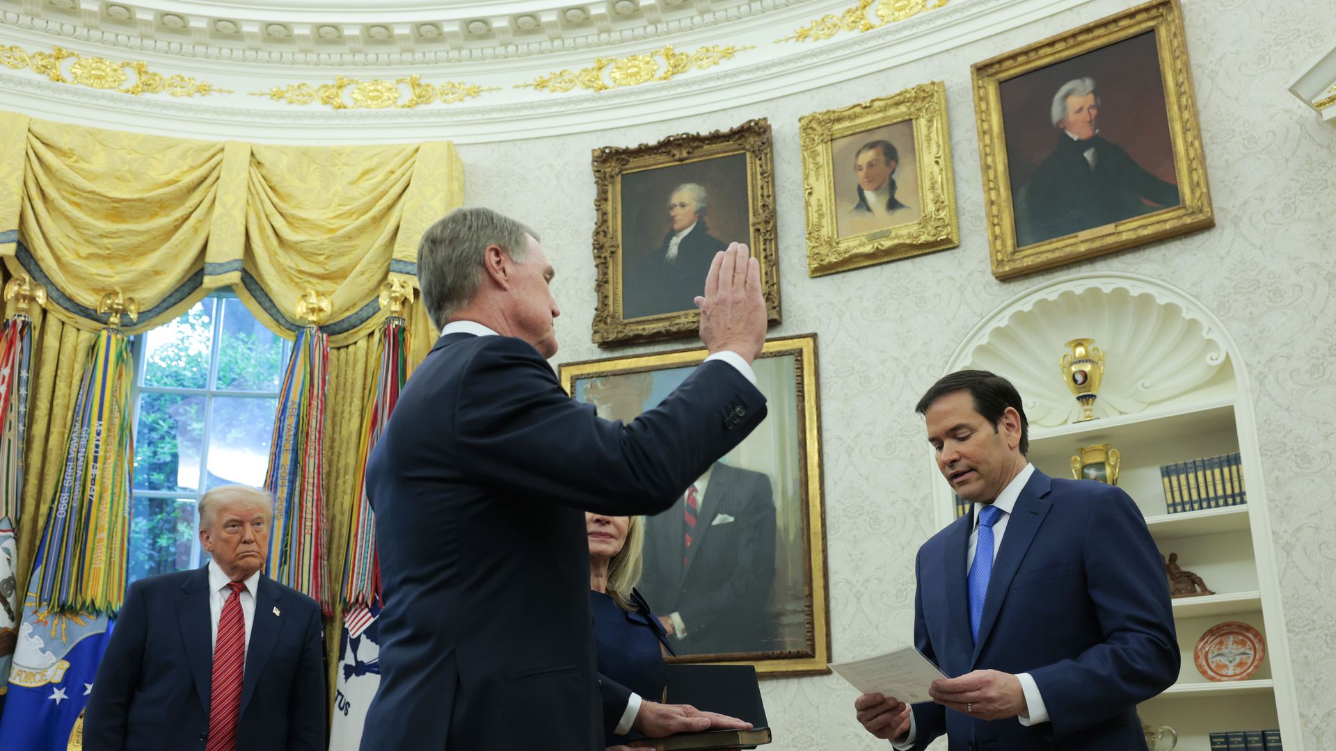 President Trump watches David Perdue be sworn in as U.S. ambassador to China in the Oval Office.