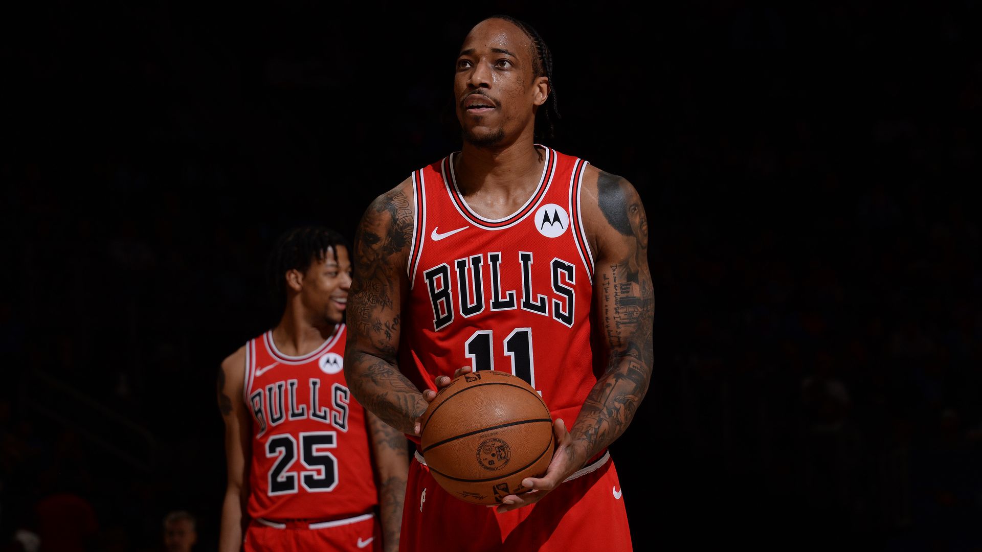 Photo of a basketball player getting ready to shoot a basketball