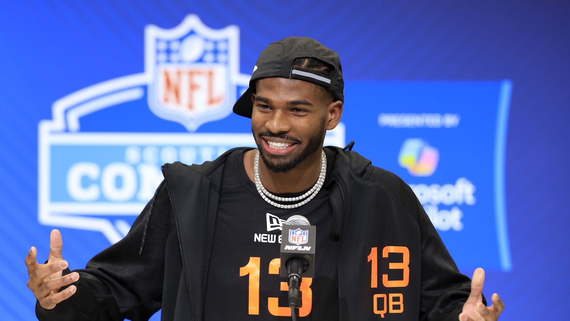 Shadeur Sanders stands at a podium at the NFL combine.