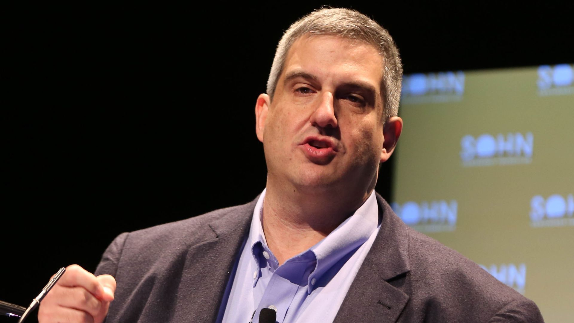 Larry Robbins, who wants more changes at Tenet Healthcare, speaking on stage