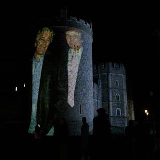 Photos: Activists beam Trump, Epstein images onto U.K. castle during president's visit