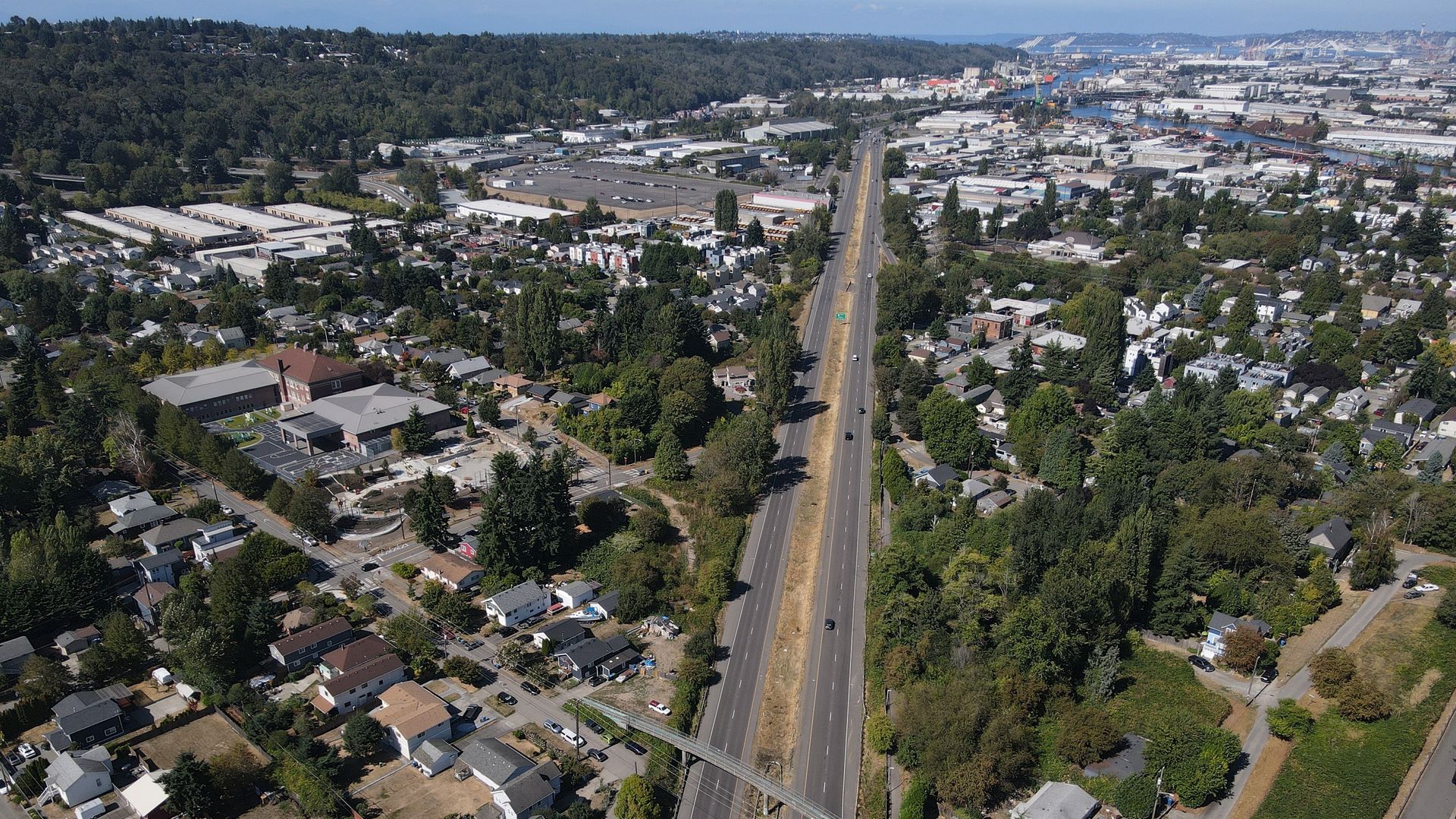 A bird's eye view of a highway running through an industrial area of Seattle.