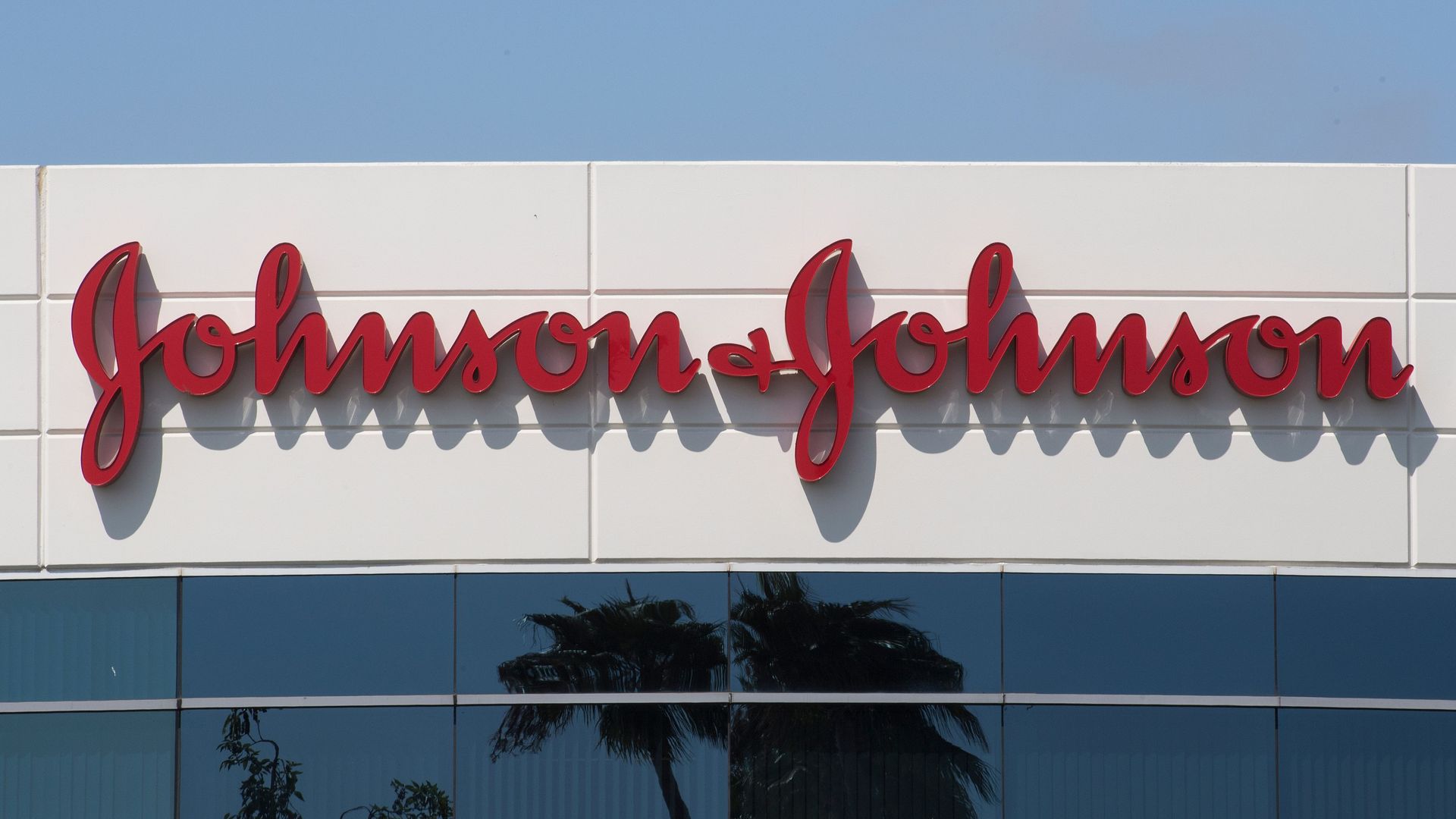 The red Johnson & Johnson logo on a building.