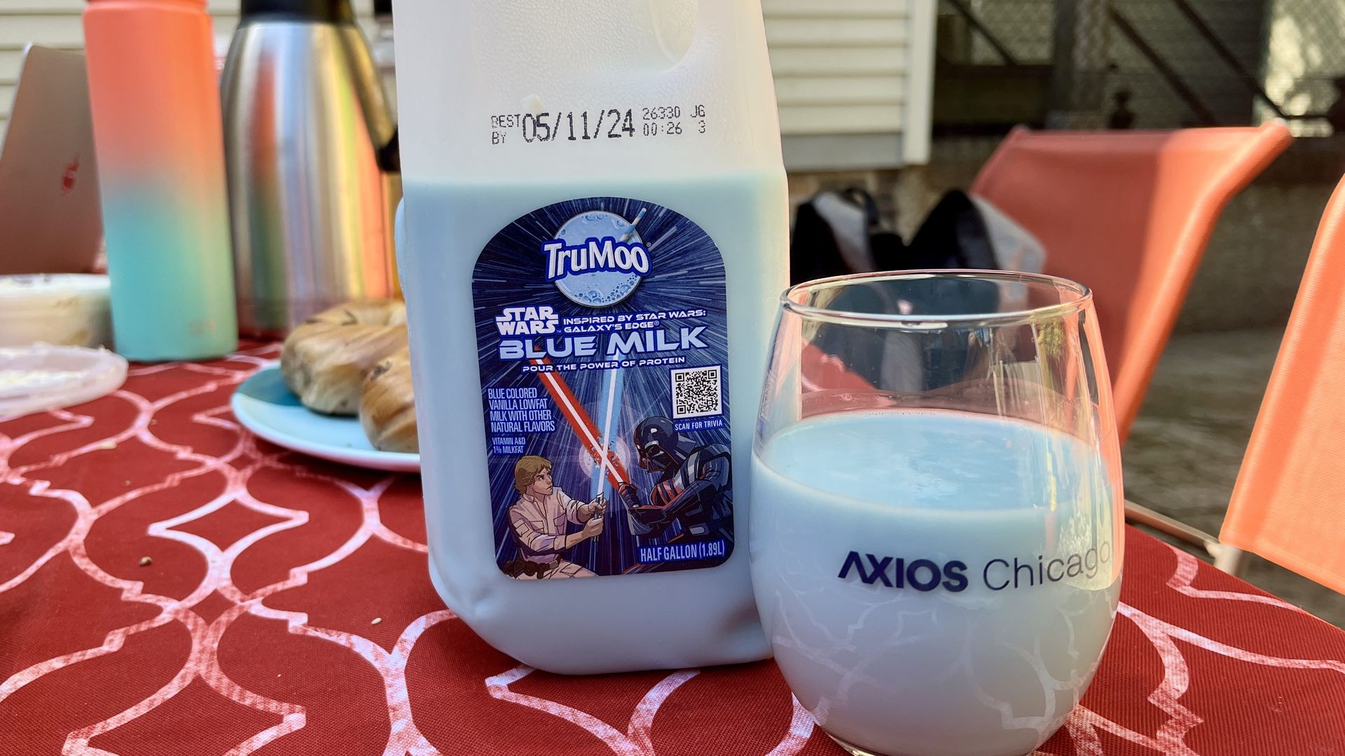 Photo of a glass of blue milk on a table.