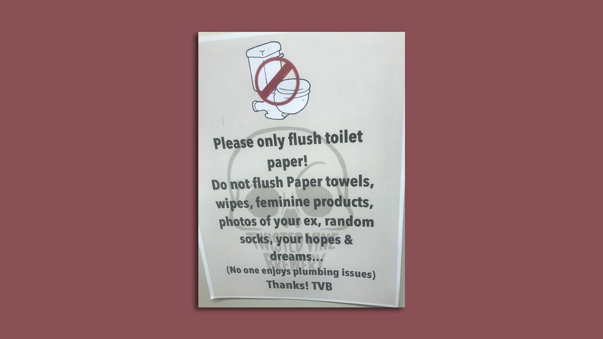 A photo of a bathroom sign.