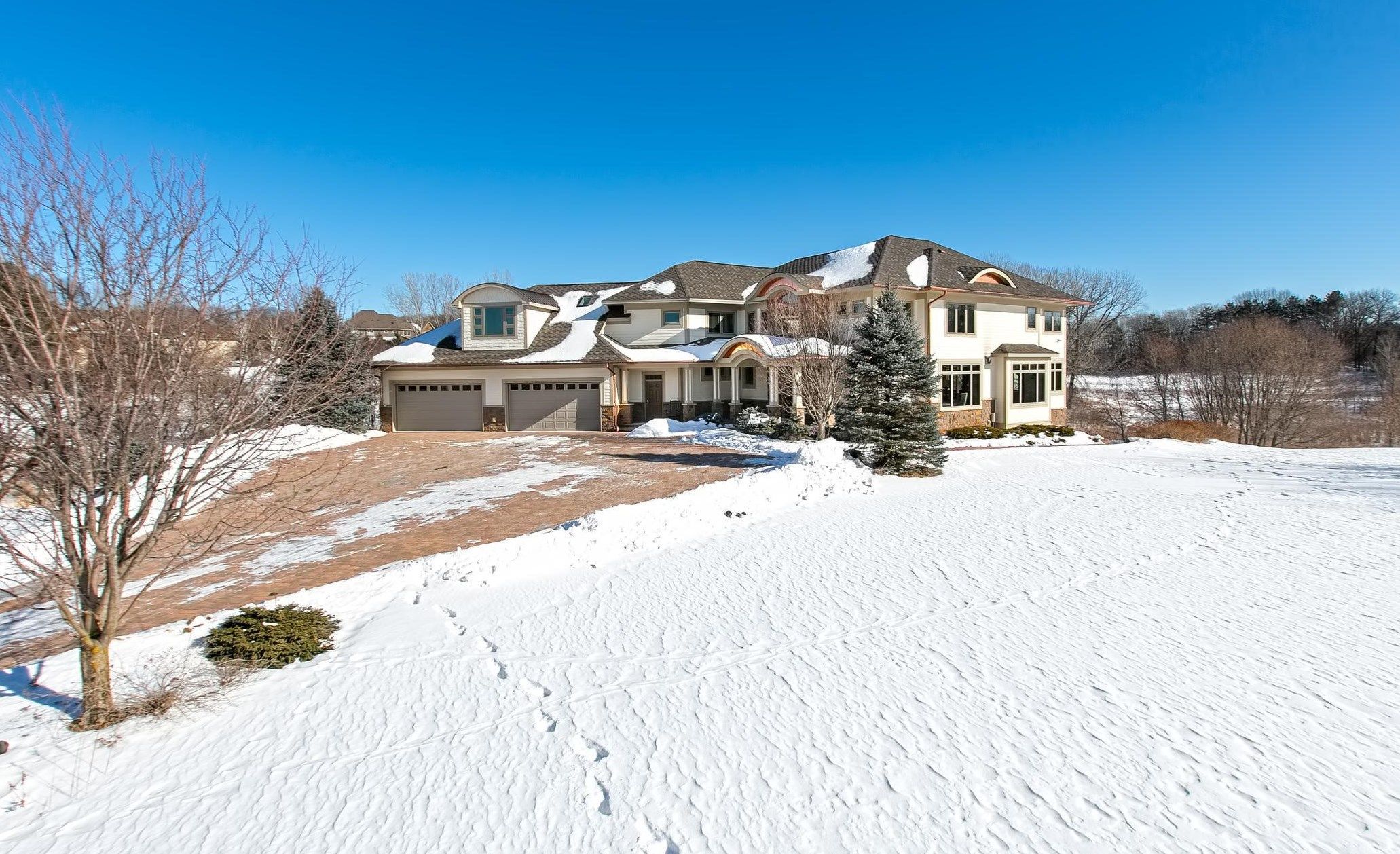 Exterior of Mike Zimmer's house. A pretty boring suburban home, with a white exterior and brown roof.