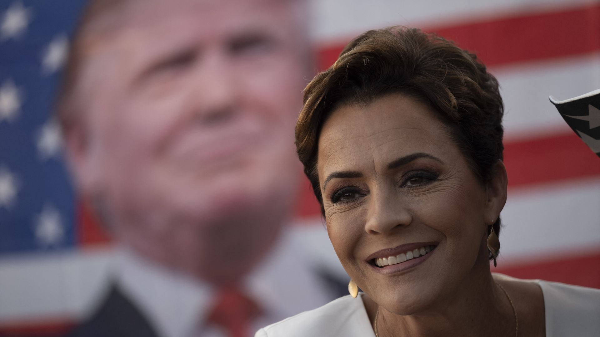 US Senate candidate and former Arizona Republican gubernatorial candidate Kari Lake signs books prior to a rally held by former US President and 2024 Republican Presidential hopeful Donald Trump, at Ted Hendricks Stadium at Henry Milander Park in Hialeah, Florida, on November 8, 2023.