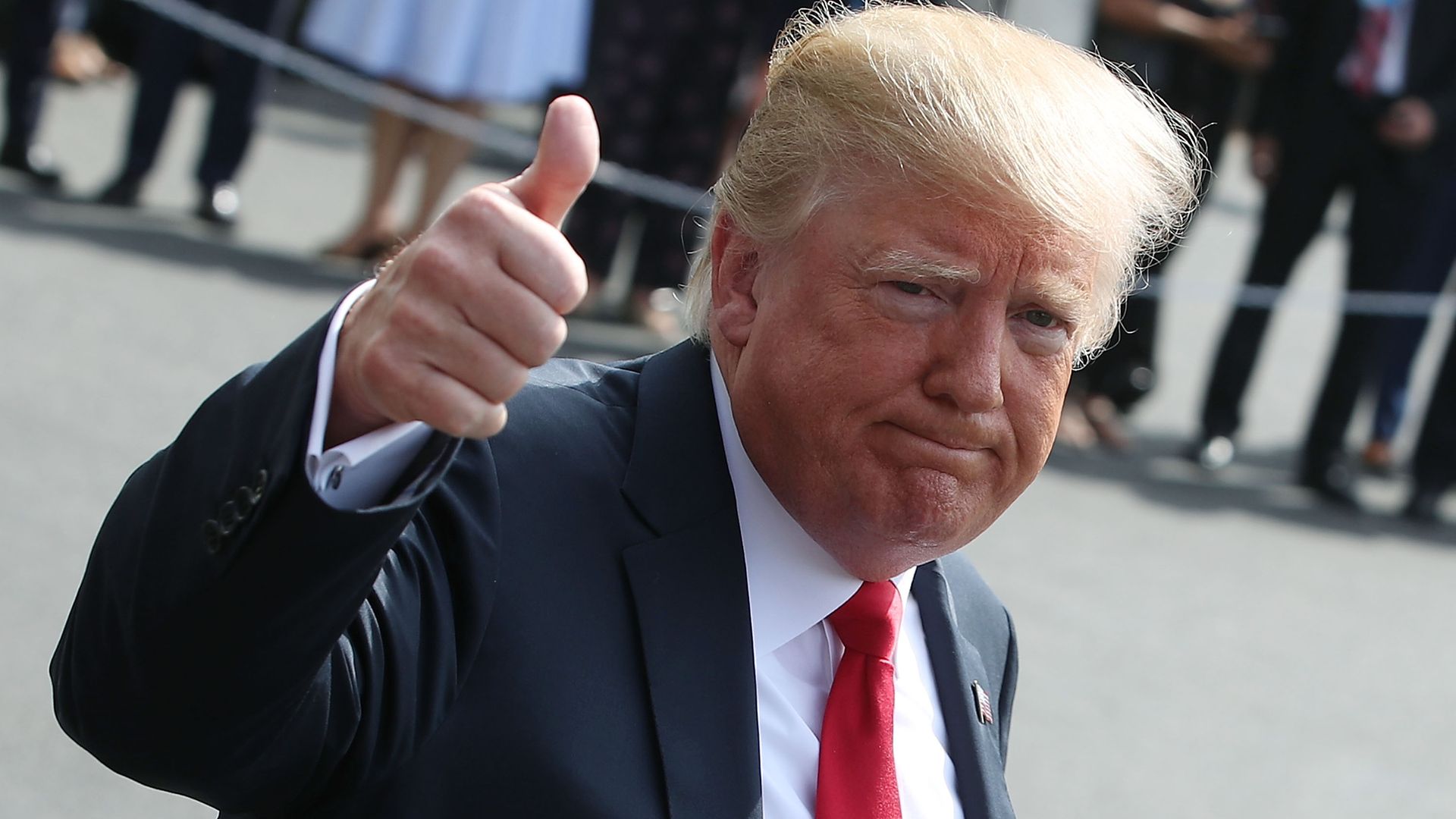 Donald Trump giving a thumbs-up.