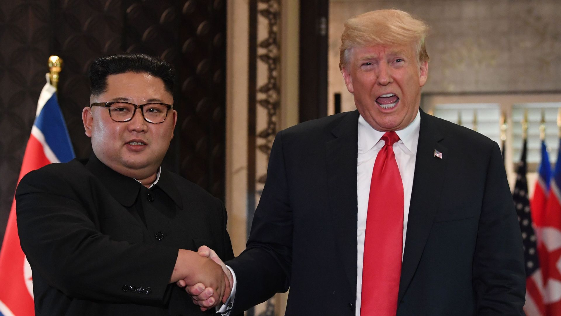 Trump and Kim shake hands
