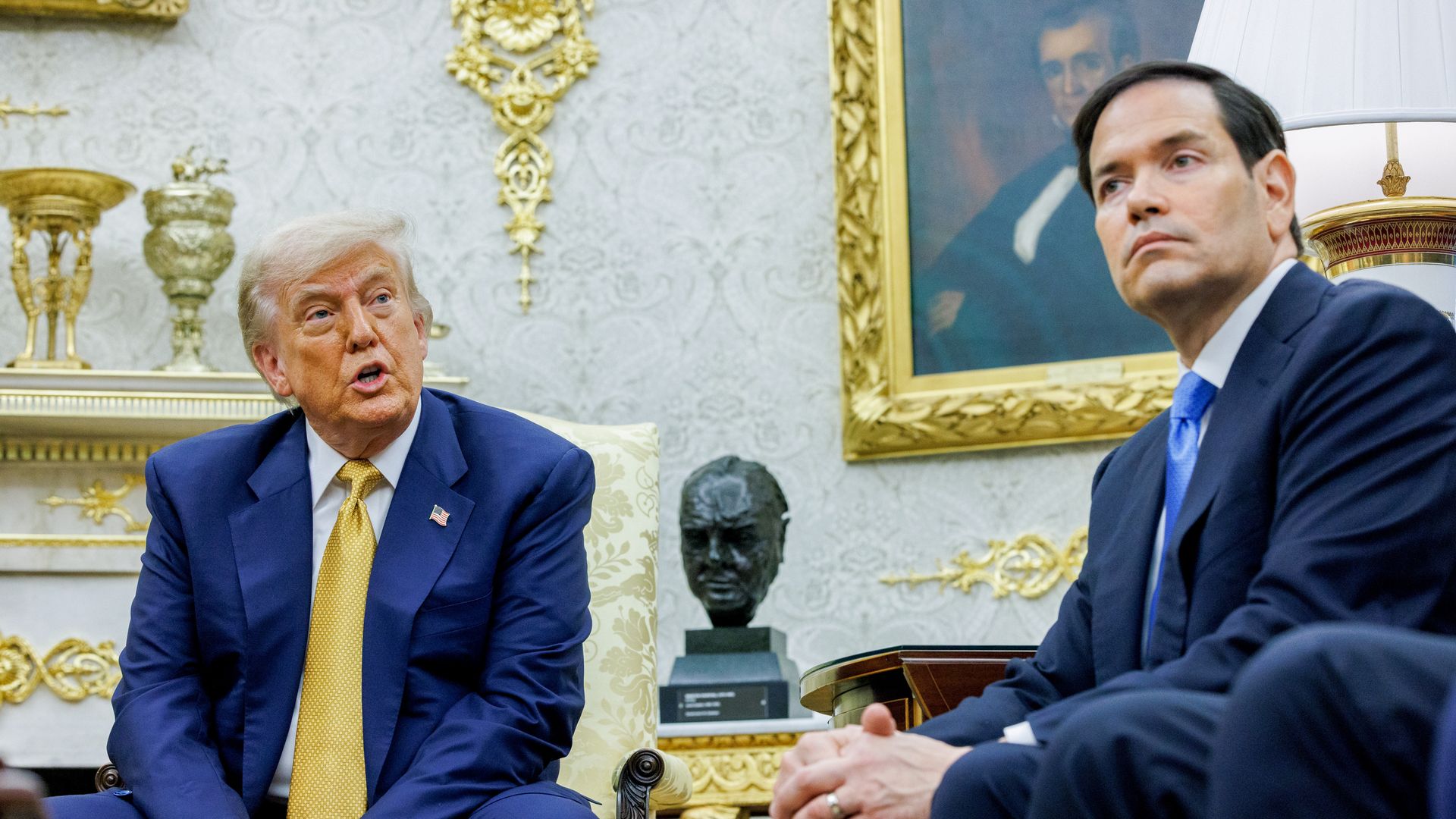 Trump and Marco Rubio sit opposite each other.