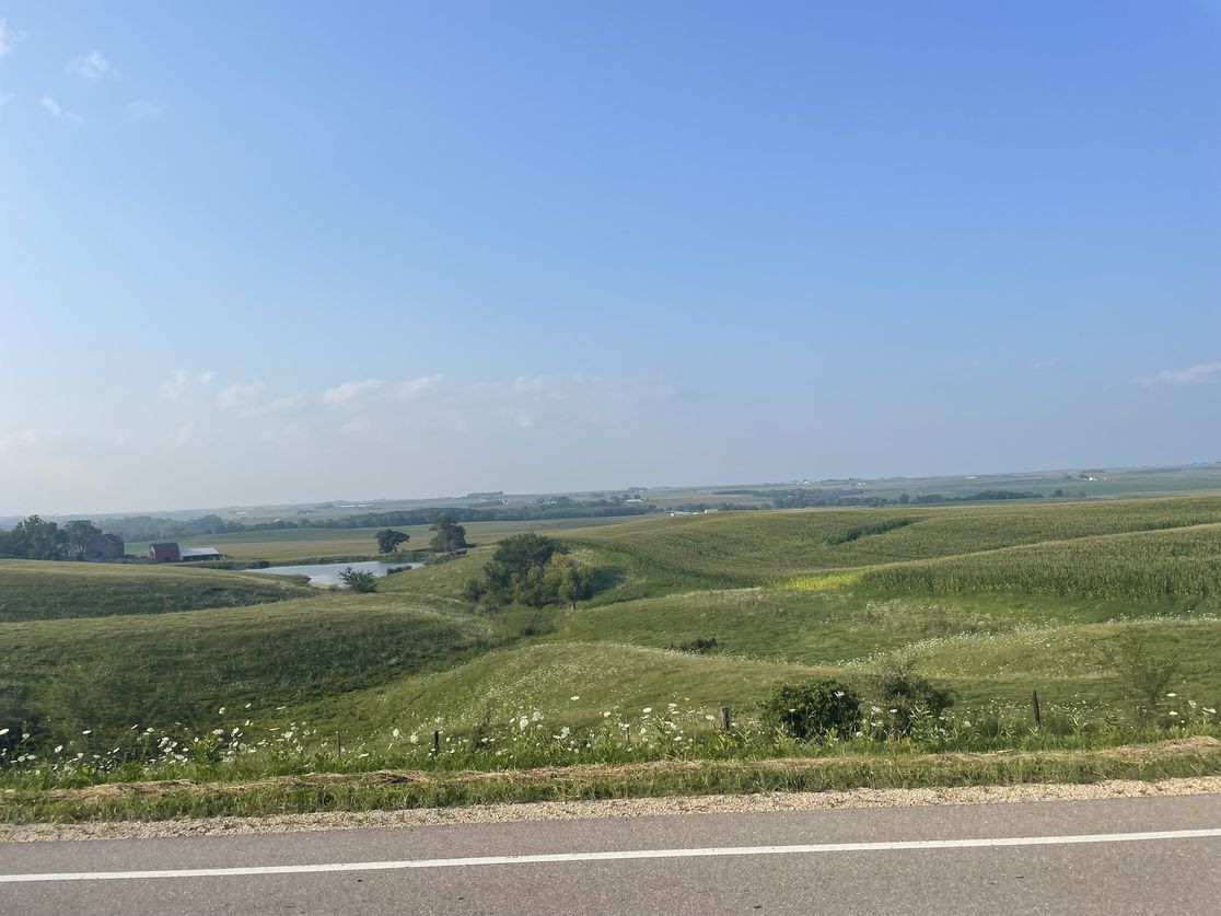 A landscape of green hills on the way to Anamosa.