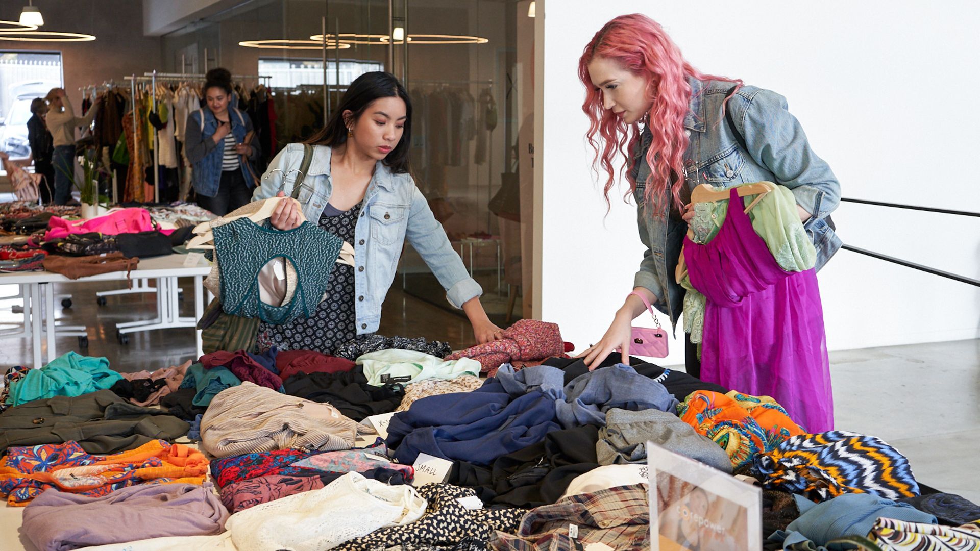 two women shop for clothing