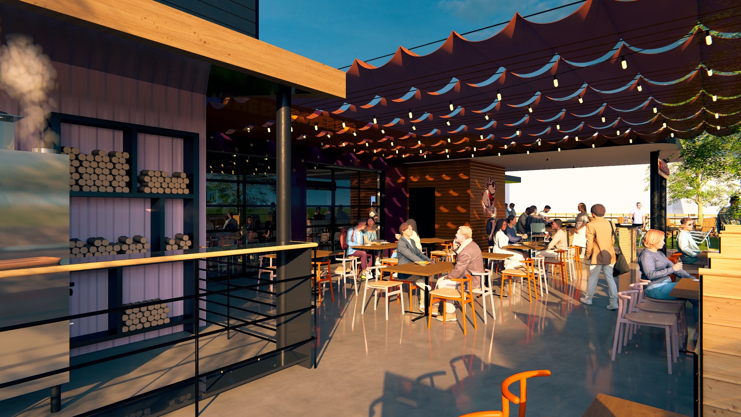 Outdoor cafe with people sitting at wooden tables under red fabric canopy with hanging lights, a smoker with stacked wood on the left, and trees visible on a sunny day.