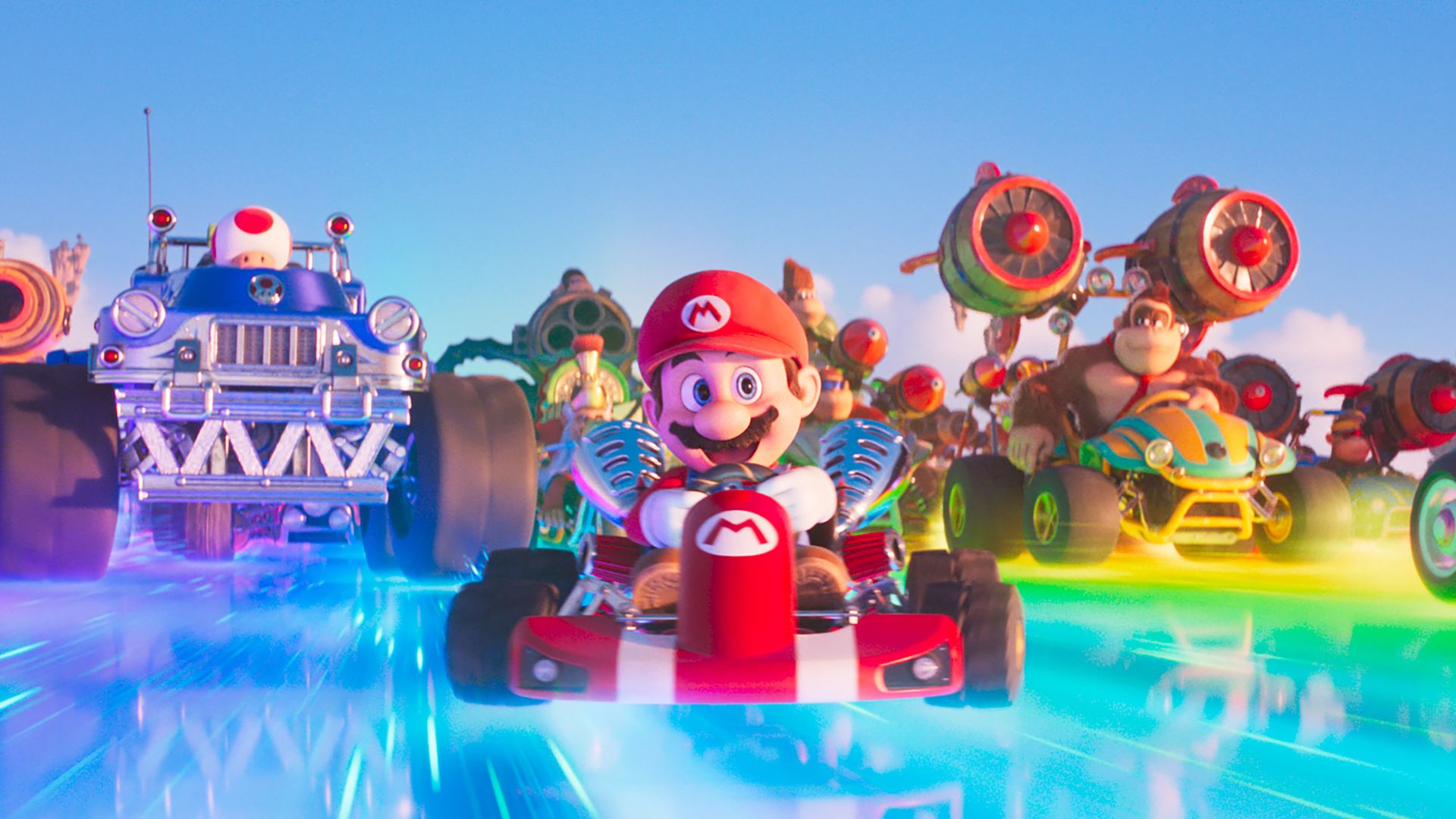 Characters race in karts in The Super Mario Bros. movie. 