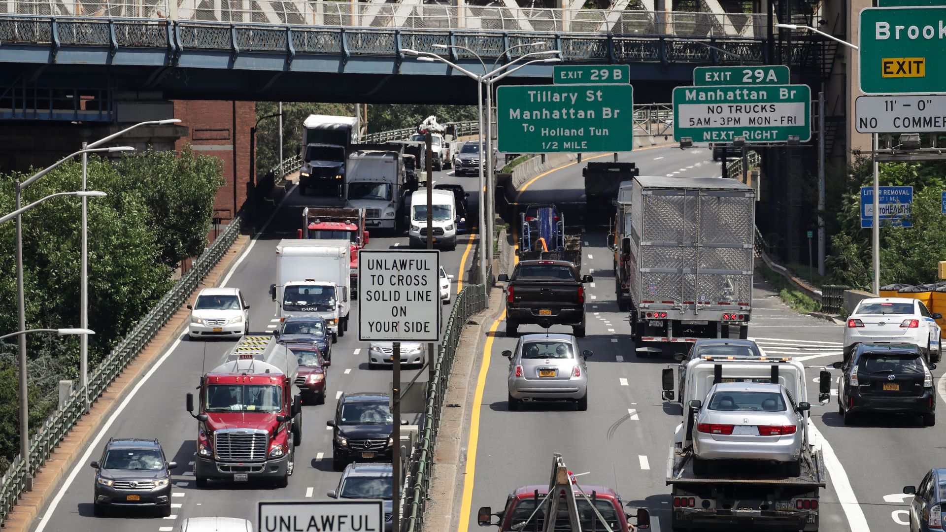 Cars going down a highway.