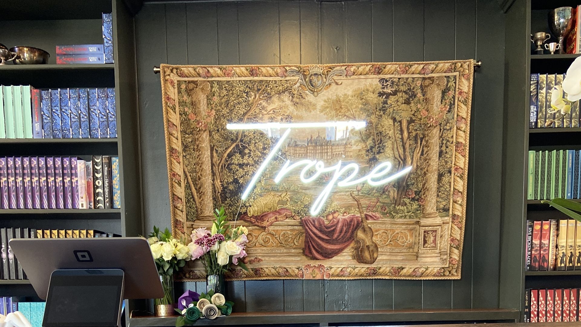 Trope sign behind the counter.