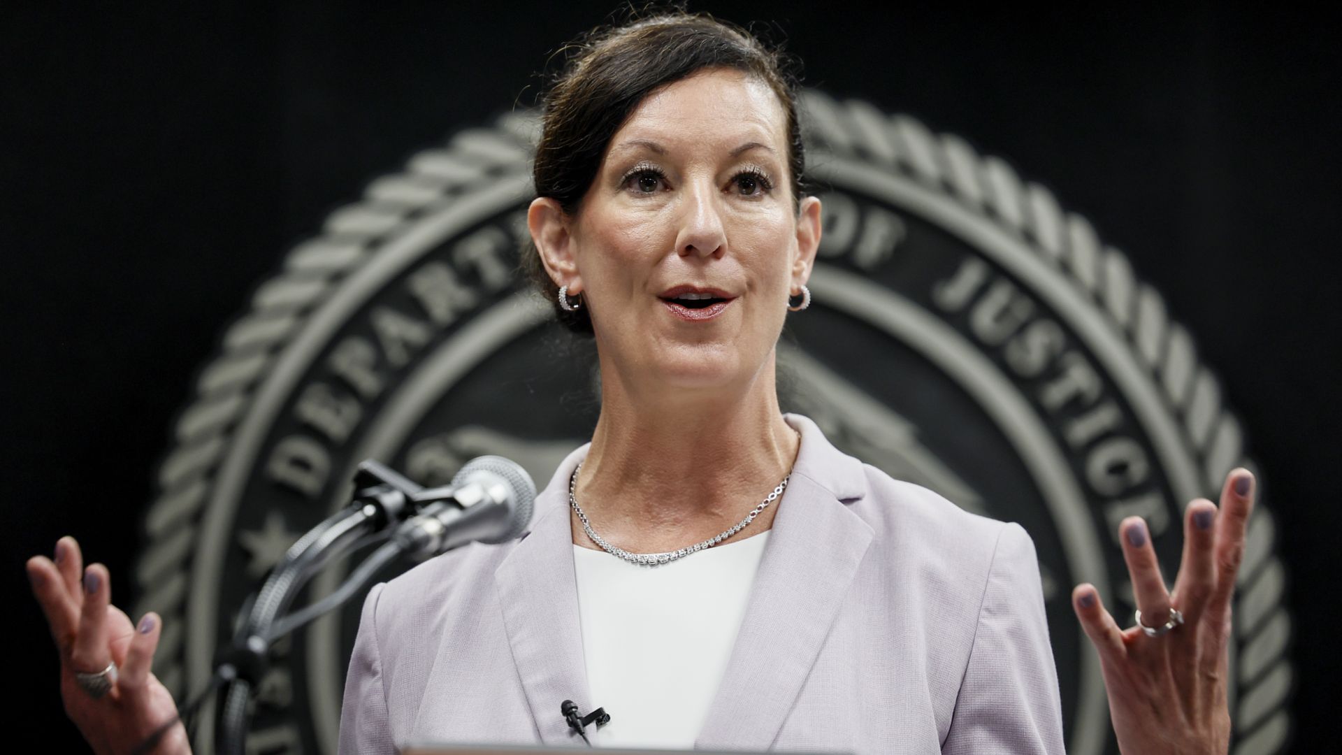 U.S. Bureau of Prisons Director Colette Peters delivers remarks after her swearing in at BOP headquarters.